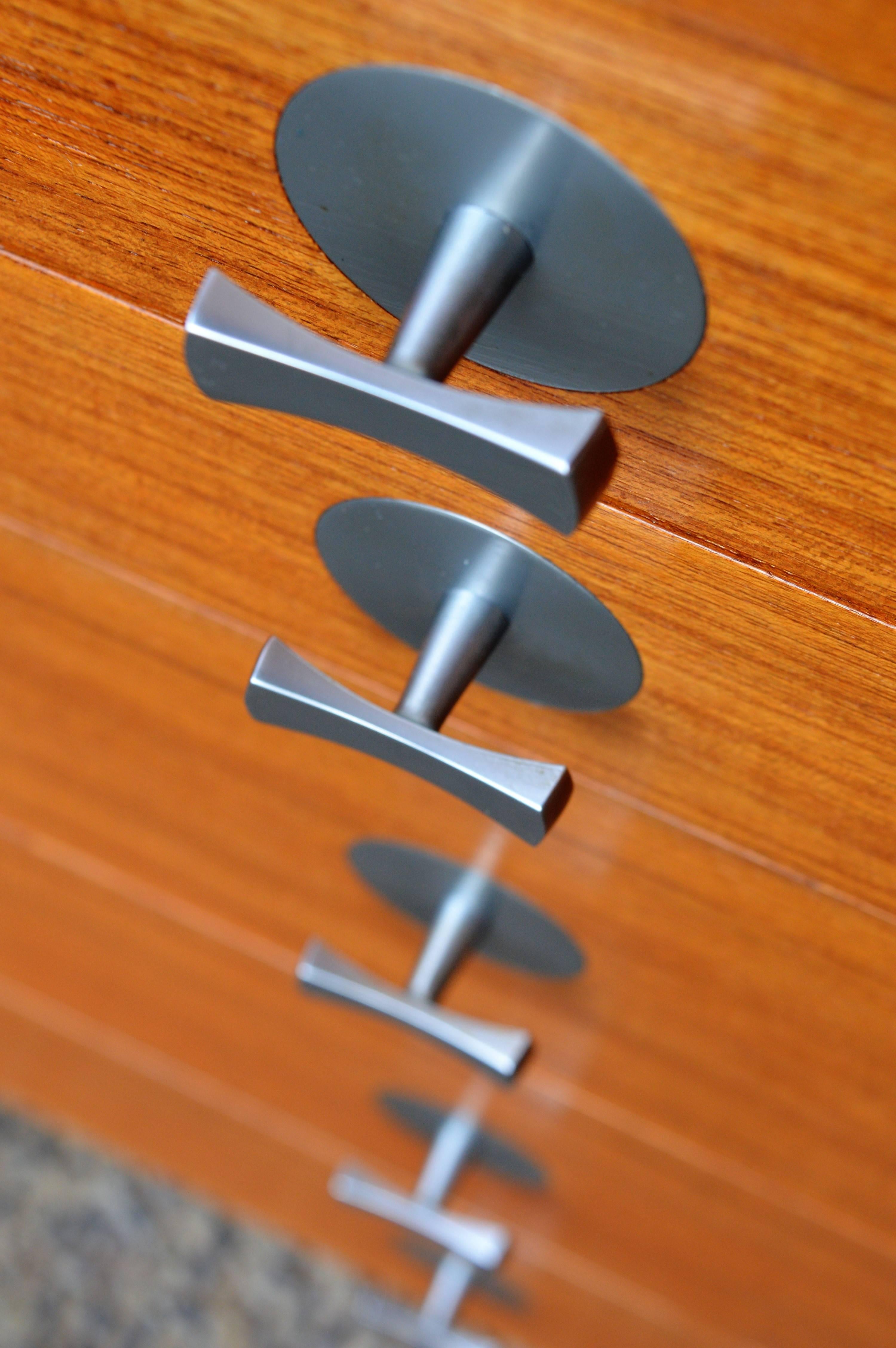 This exquisite piece is a rare design by Finn Juhl for France & Son and features his iconic bow-tie chrome door and drawer pulls and is part of the Cresco Series. Extremely well designed with top quality hardware throughout - the hinges are