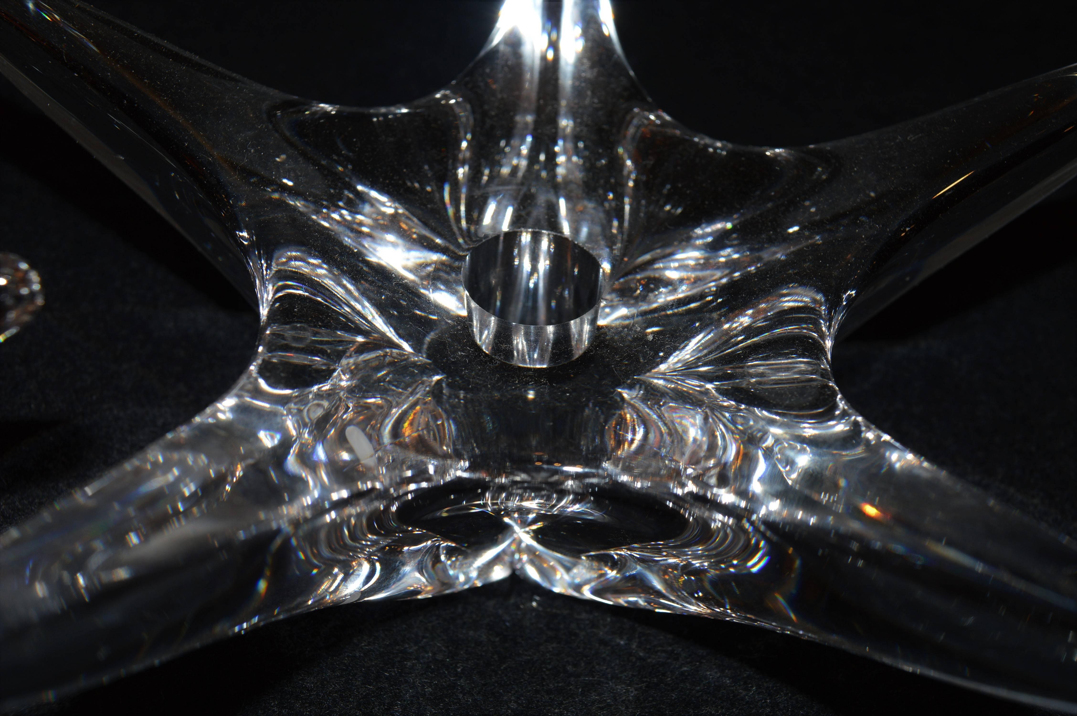 This wonderfully organic star shaped pair of rare Daum crystal candlesticks are in phenomenal condition, with no chips, cracks or flea bites. The silver disc at the bottom of the candle hole is missing on one, which is not visible when a candle is