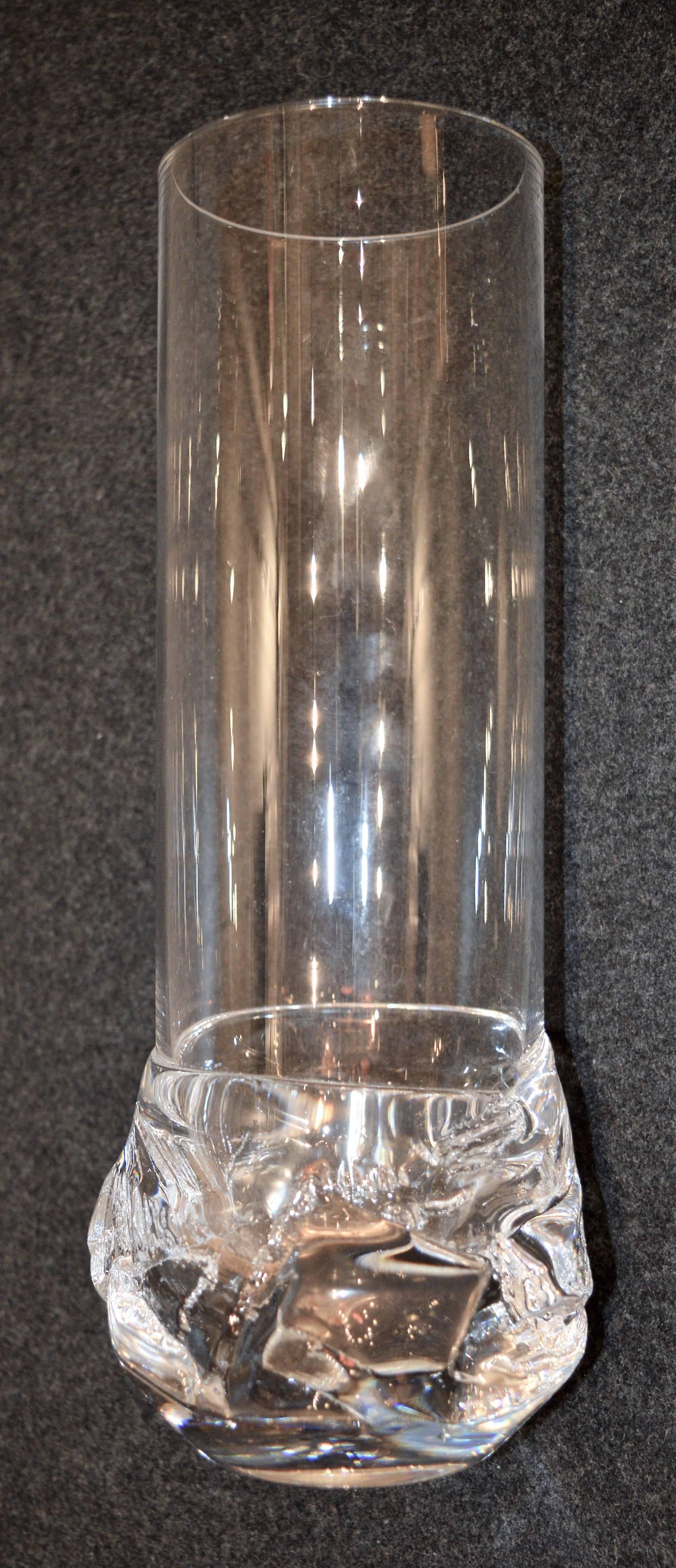 This spectacular Brutalist based cylinder vase was made by Daum in crystal and is signed. The contrast between the textured and sculptural base, with the clean upper cylinder, is extremely effective. In fabulous condition with no chips, cracks or