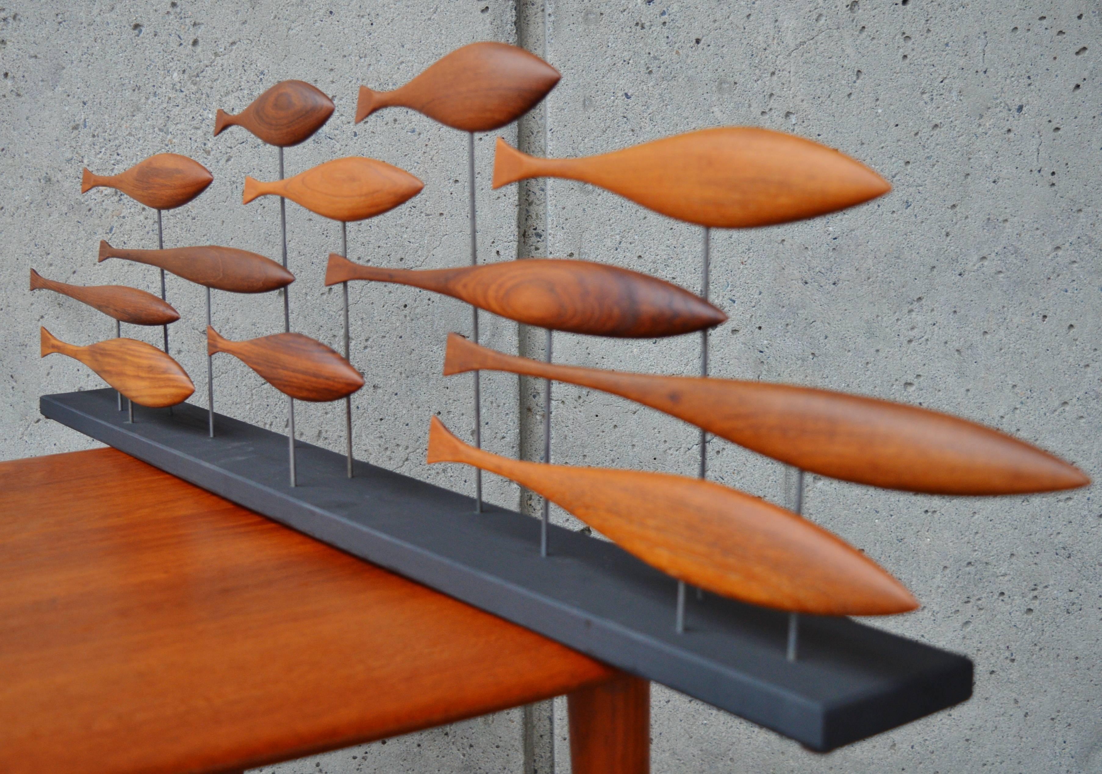 Vancouver BC artist, Tyler Fritz has always had a love of Danish Modern teak and walnut Mid-Century furniture. Coming across pieces that have been destroyed beyond being restored, he decided to salvage and carve the hardwood remnants into delightful