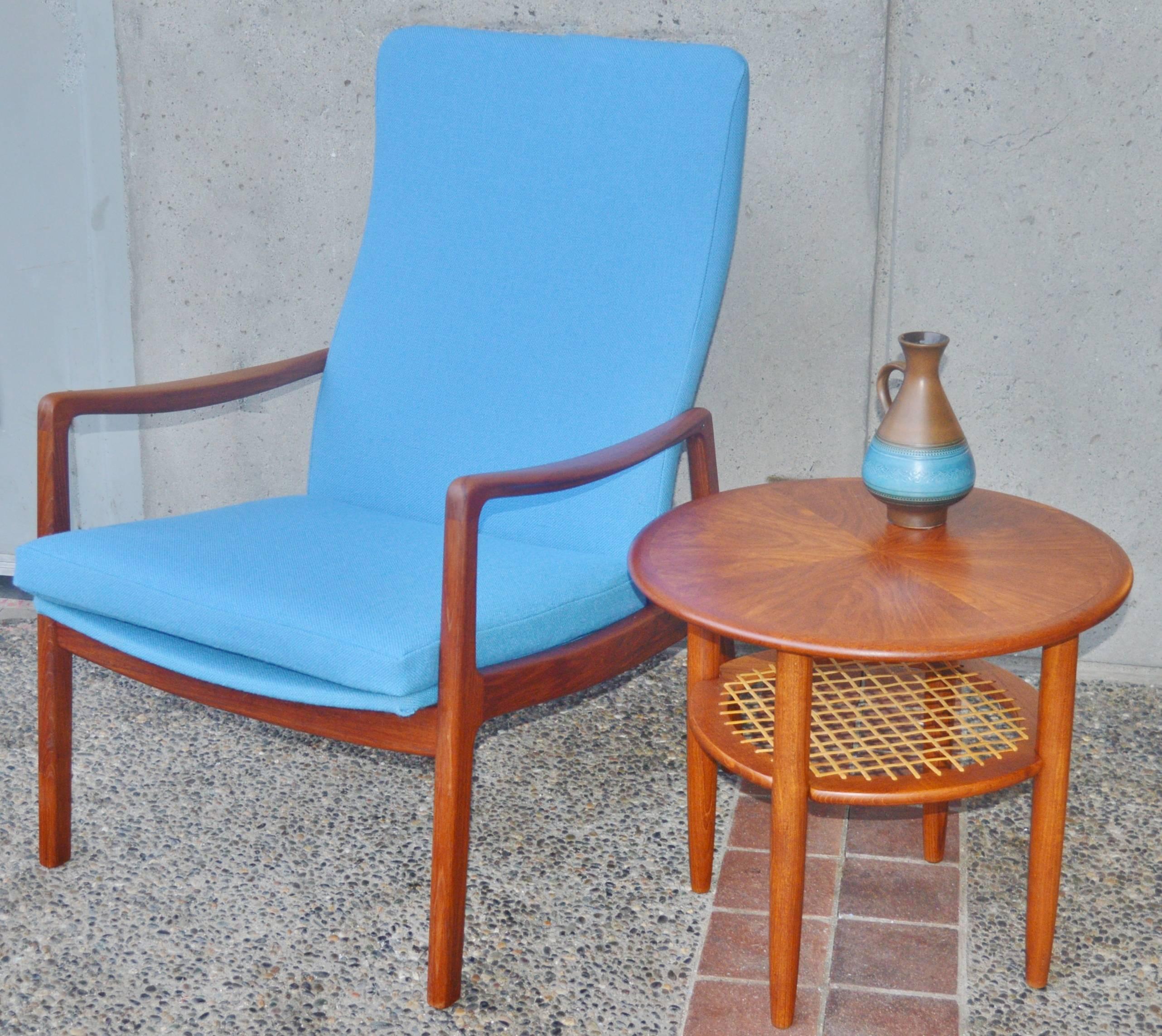 This gorgeous and rare high back Danish modern teak lounge chair was designed by Ole Wanscher in the 1950s for France & Son. Completely restored and reupholstered with new foam and a lovely blue Kravdrat wool. The frame is curved throughout - with