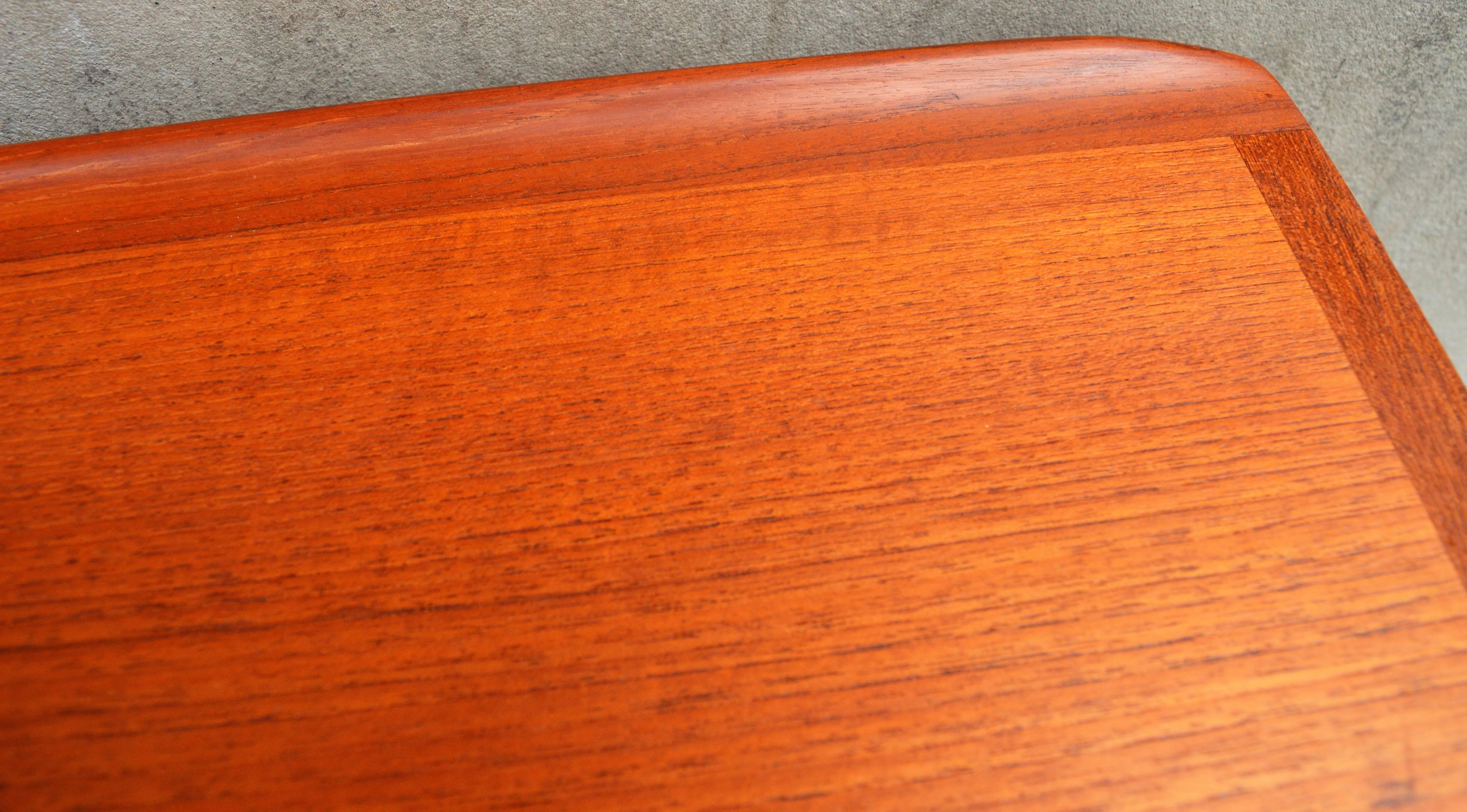 Mid-Century Modern Danish Teak Coffee Table Flared Edges and Lower Cane Shelf by Mobelintarsia