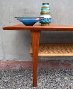 Danish Teak Coffee Table Flared Edges and Lower Cane Shelf by Mobelintarsia