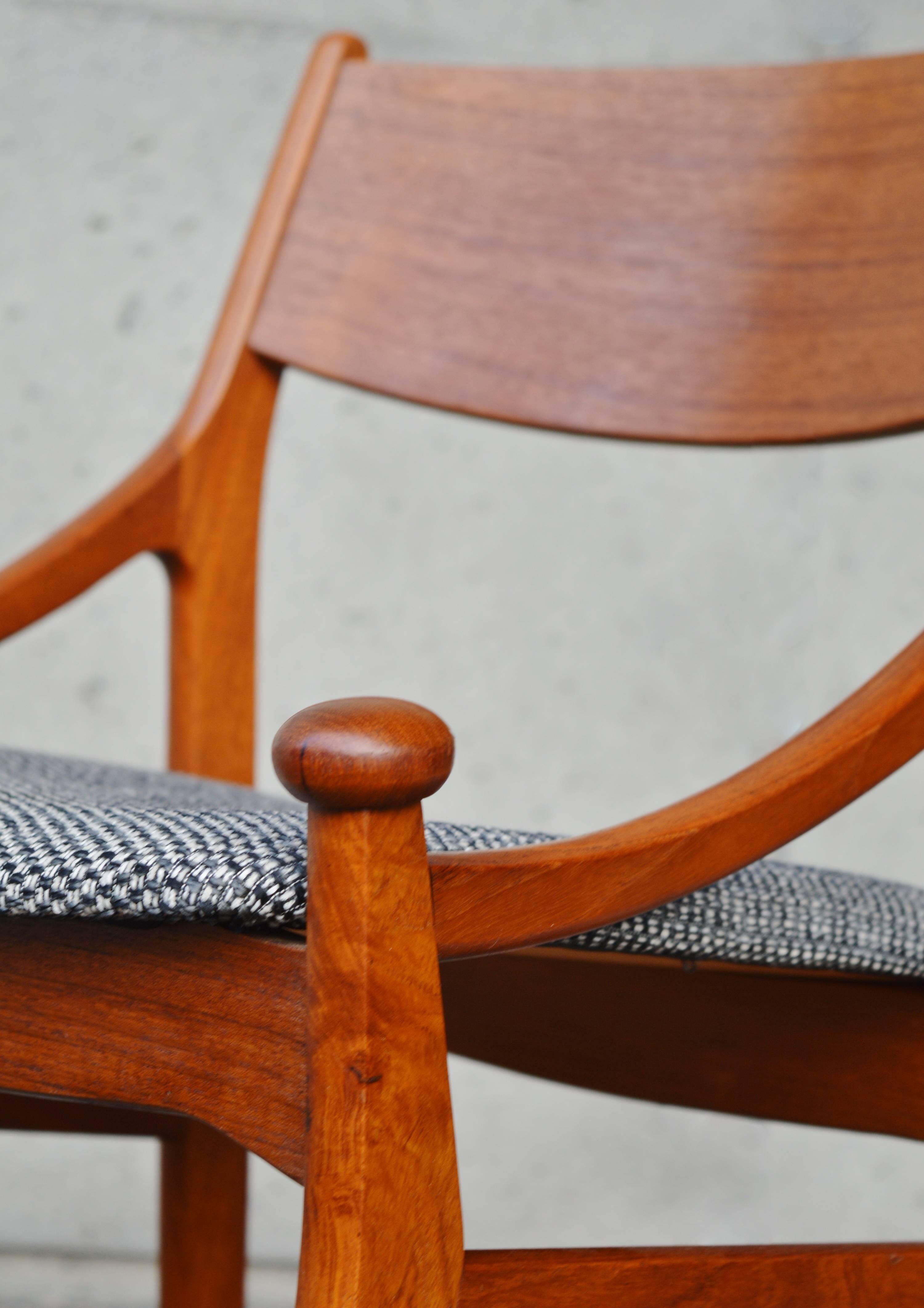 These amazingly elegant and stylish Danish modern teak model BT dining chairs are seldom seen and a unique quality design by Vestervig Eriksen for Brdr. Tromborg, Denmark. Highlighted by the curved knobs that sit atop each front leg, and a gently
