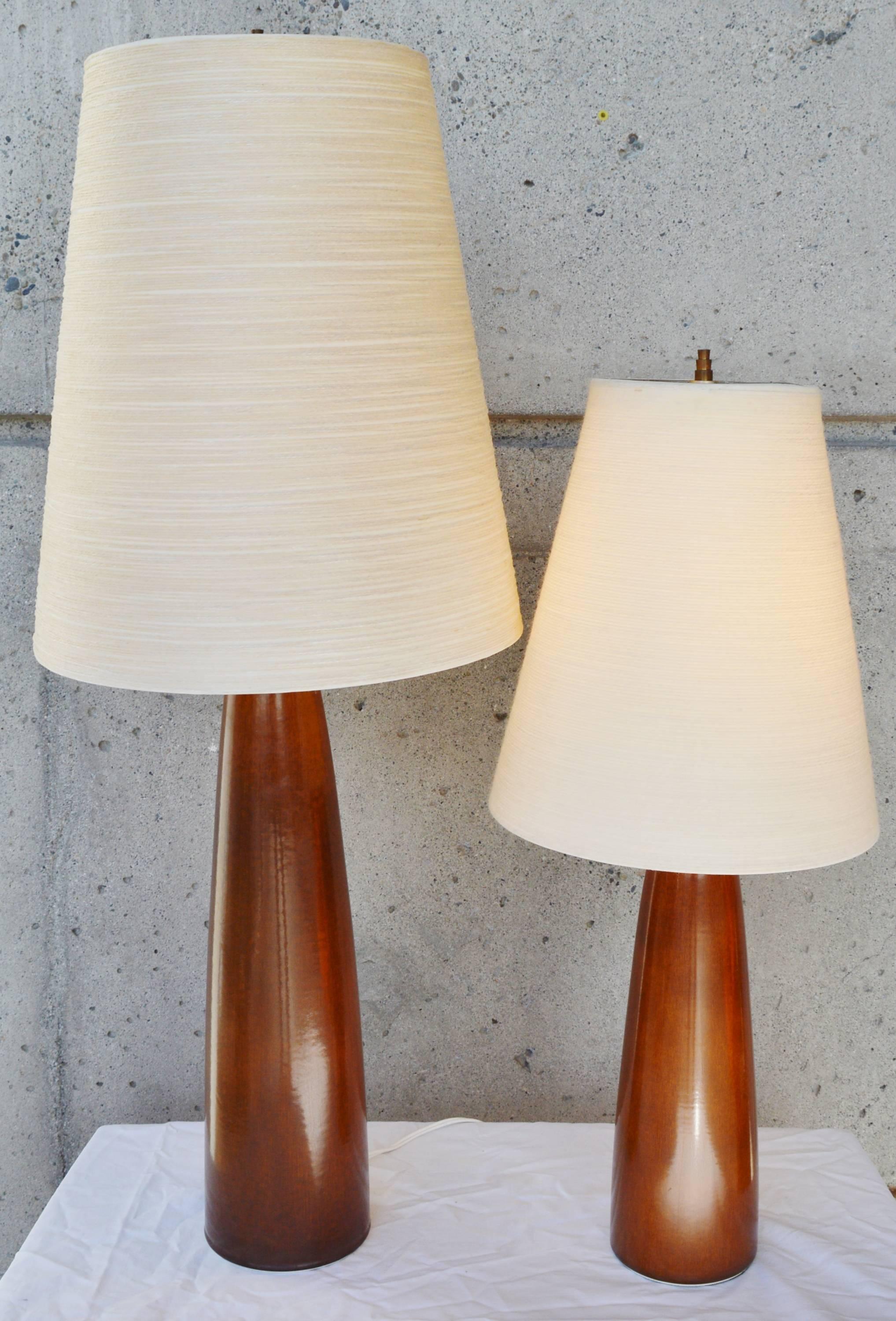 These early sculptural ceramic lamps by Lotte and Gunnar Bostlund - a Danish born couple who moved their lamp making company to Canada in the 1960s. The lamps are the same style and design, but one is larger than the other - a great design feature