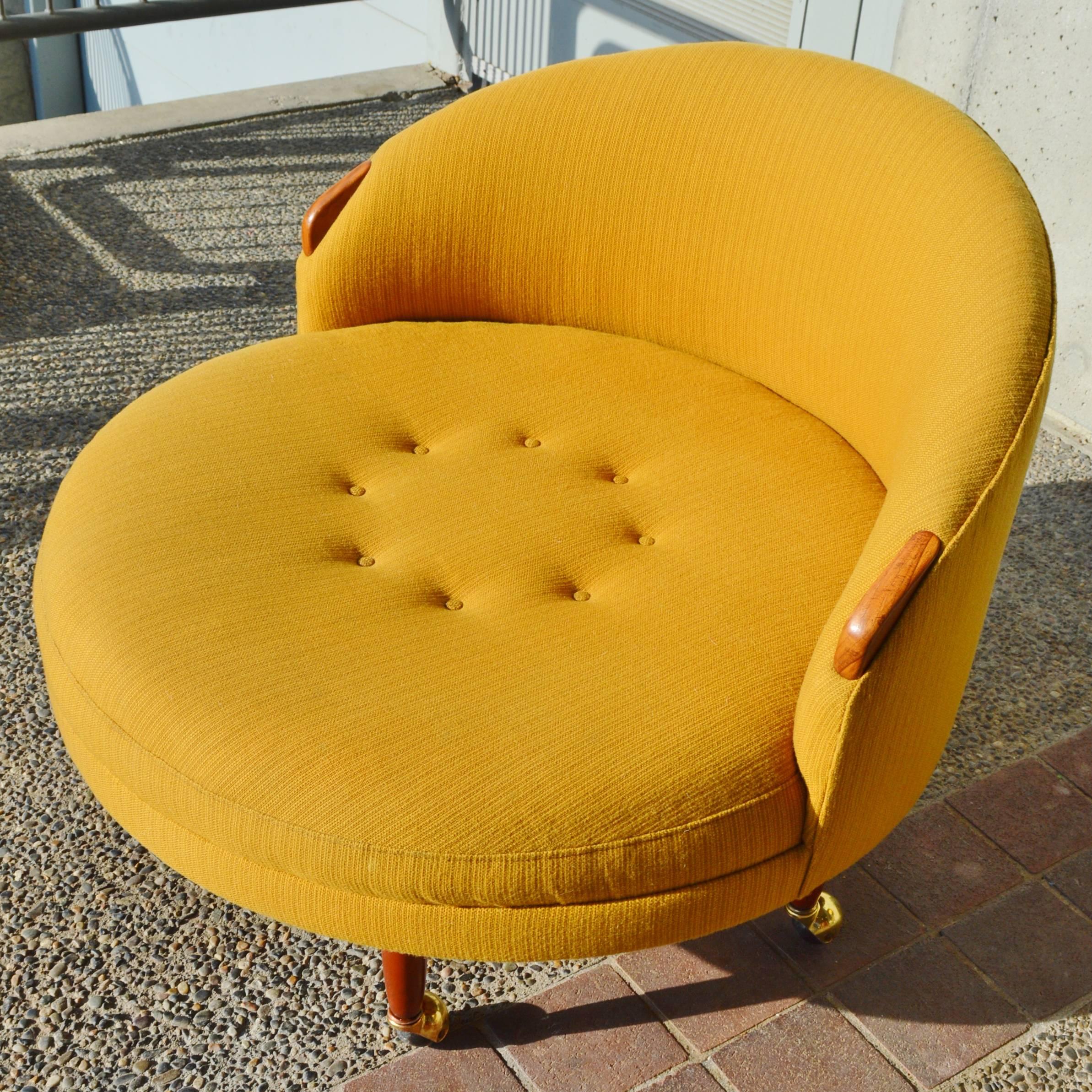 This iconic Mid-Century Modern design by Adrian Pearsall for Craft Associates in the 1960s is quite delightful! Featuring the original mustard upholstery in excellent condition with no tears or stains and whimsical walnut armrests and the Classic