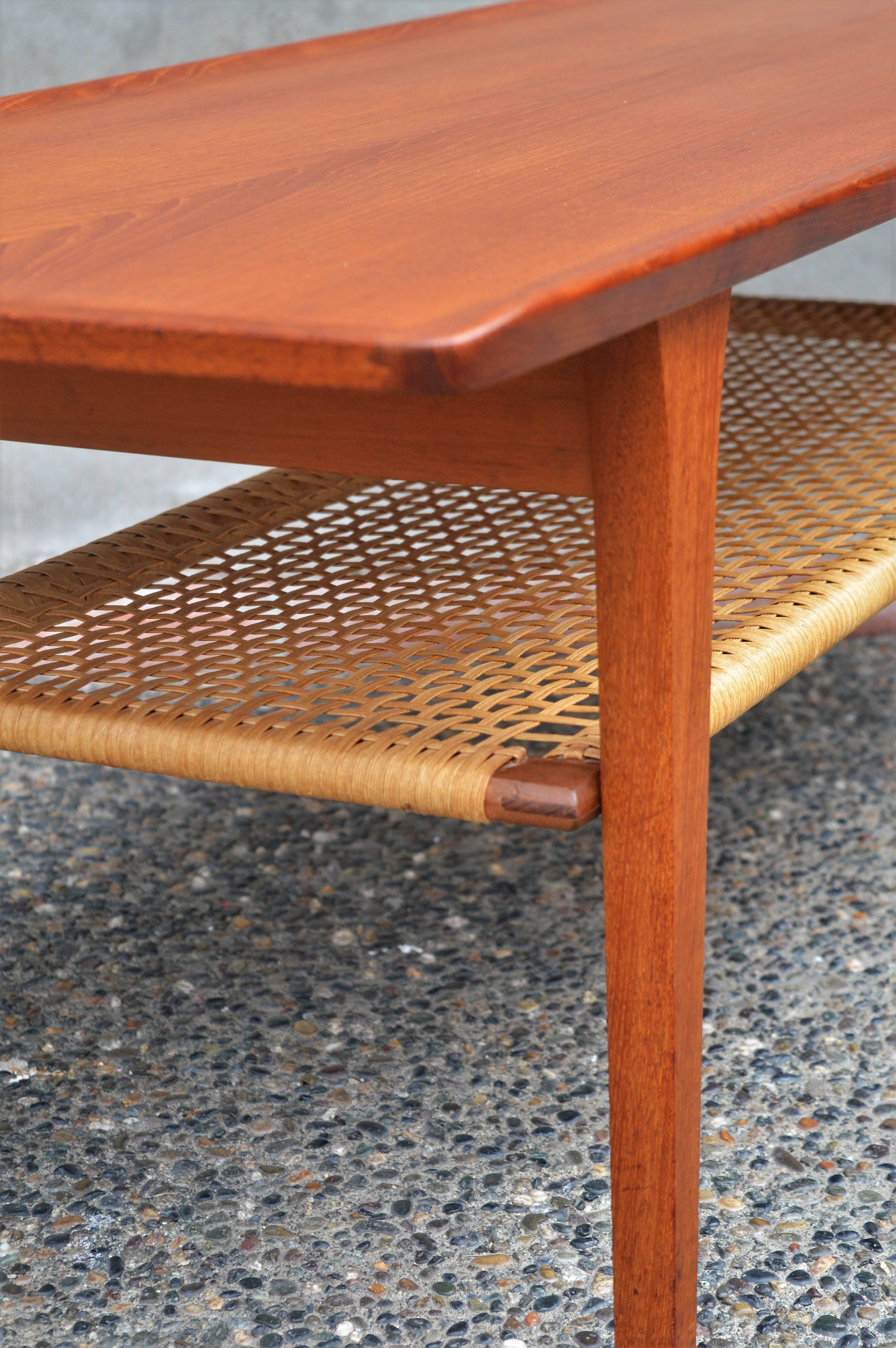Danish Teak Coffee Table Flared Edges and Lower Cane Shelf by Mobelintarsia 2