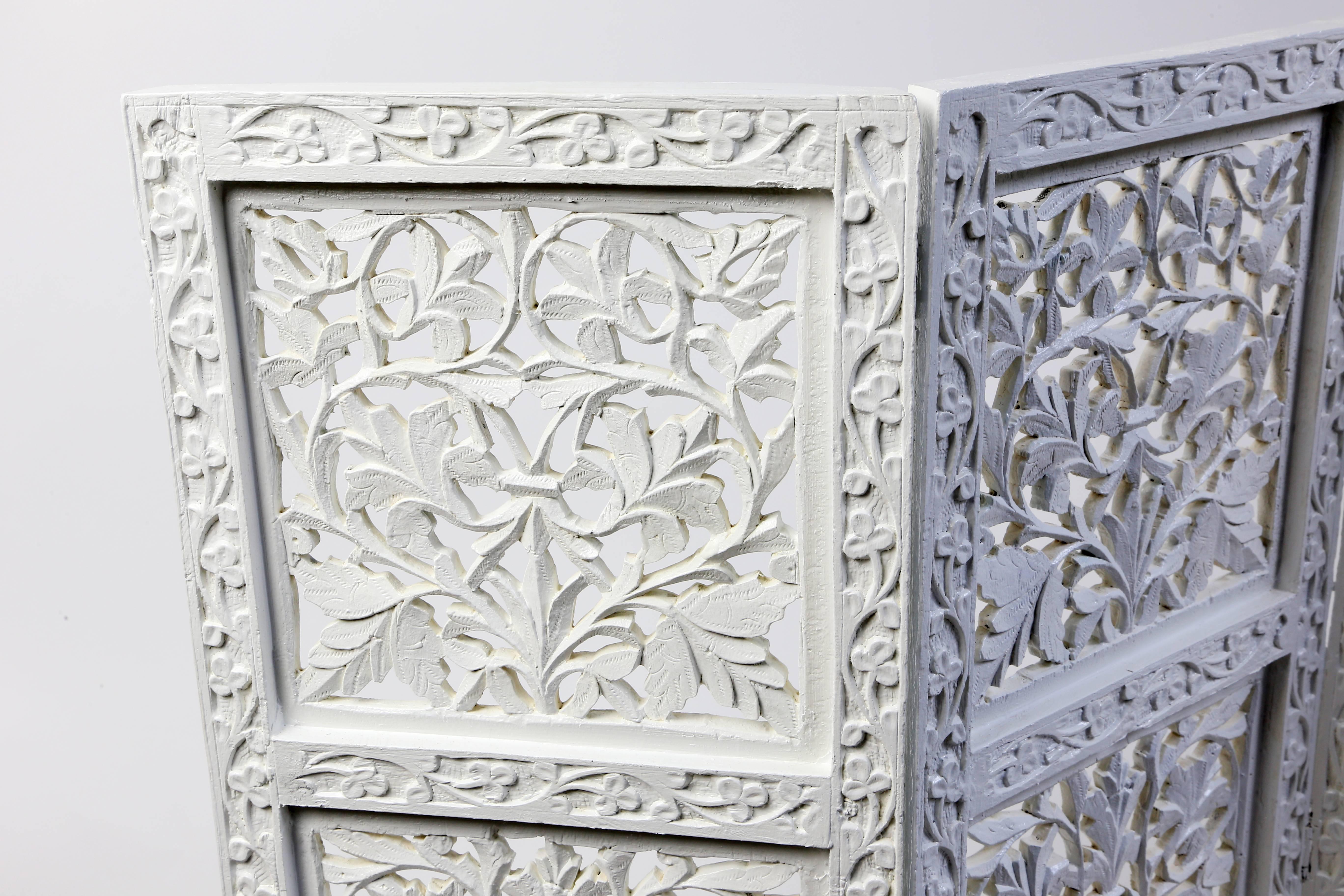 Carved four-panel folding table screen from India (originally six panels) in white lacquer, floral carved frame around carved and pierced foliate pattern screen.
