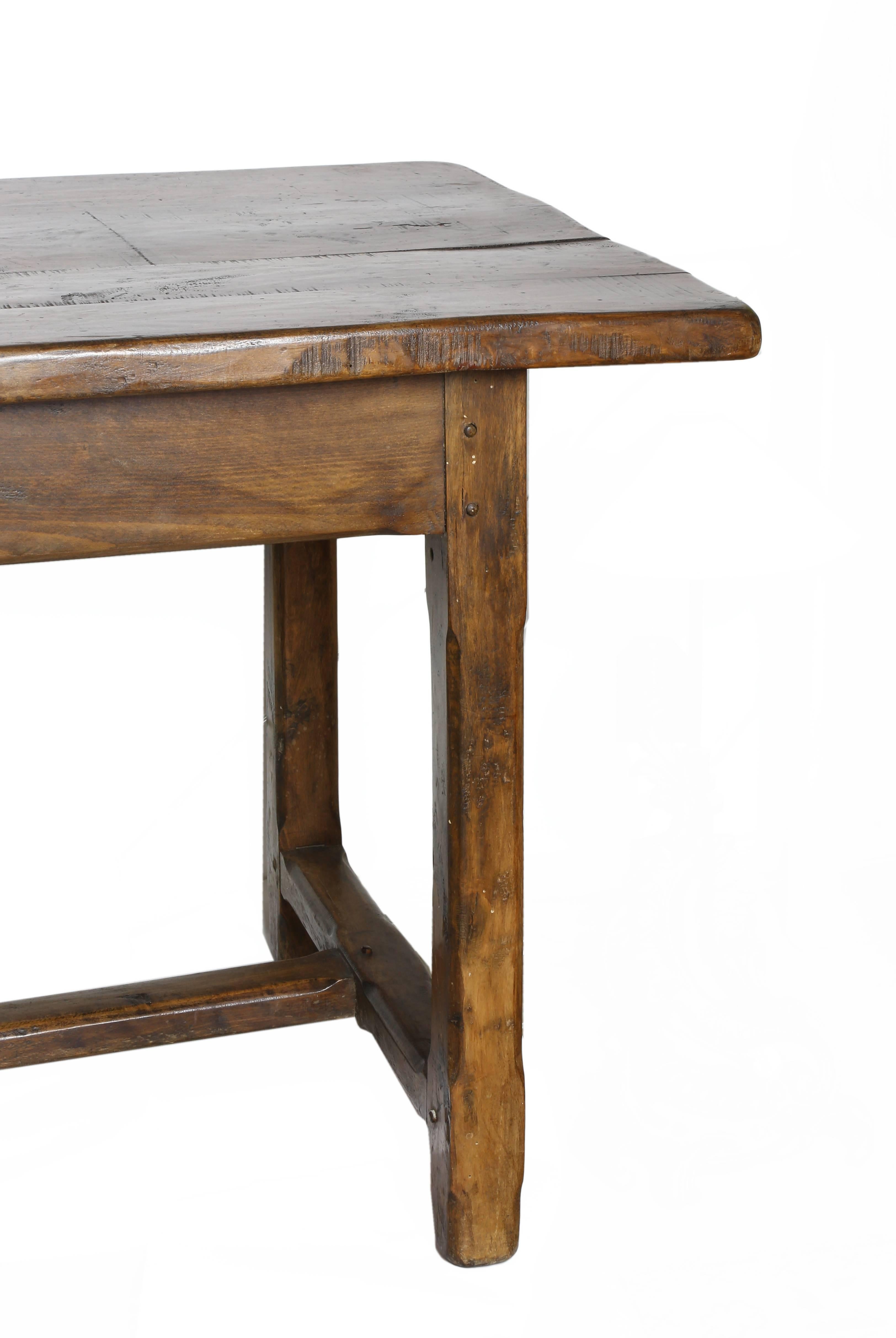 French carved walnut farm table, 19th century, four planks on the long rectangular top, rising on a stretcher base, approx 30.5