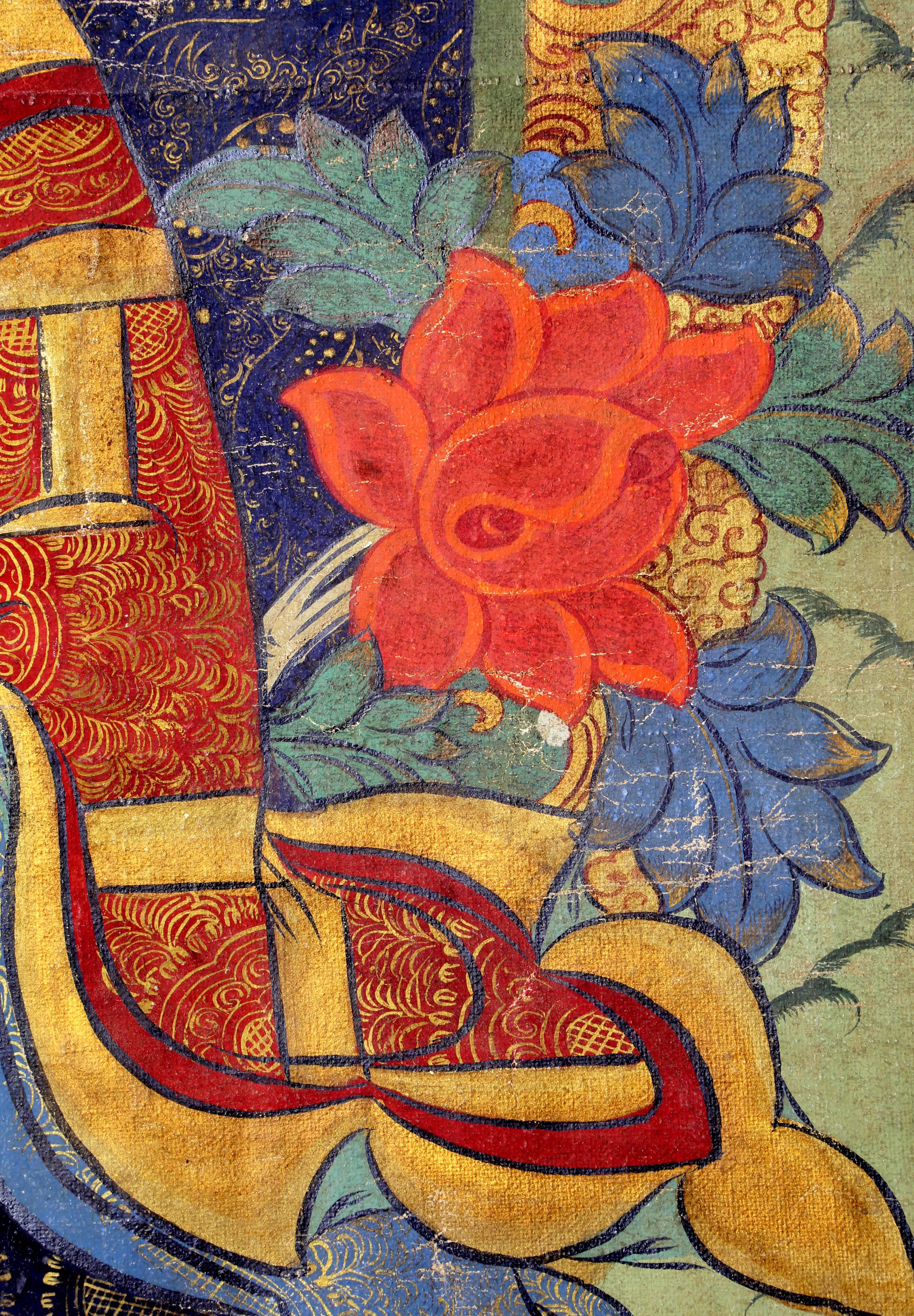 Wrapped stretcher with mounted Thangka, polychrome gouache on linen, depicting man with elongated earlobes, holding fire, with vignettes of figures at corners. Overall: 41 W x 60 H.