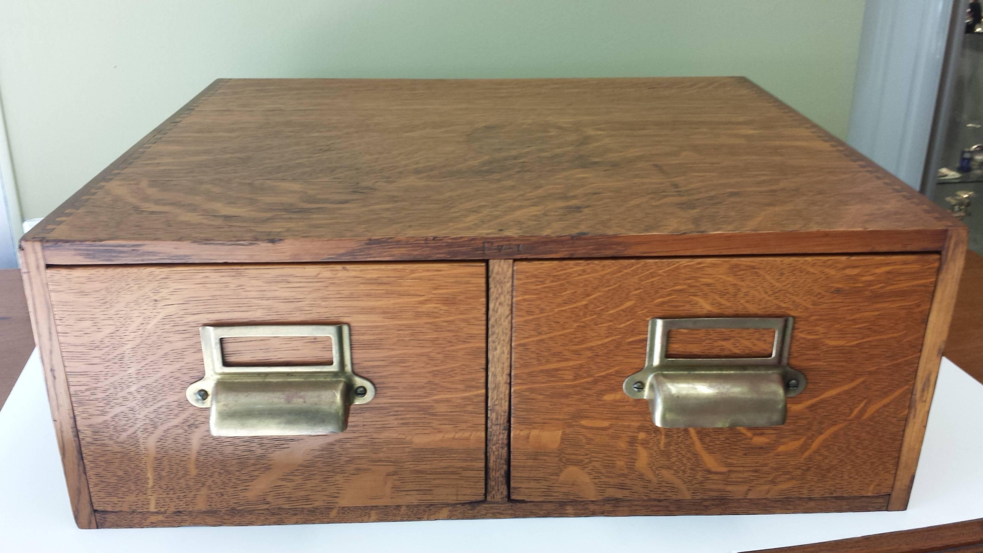 Quarter Cut Oak 2-Drawer Filing Box, With Sliding Drawer Holders, Stamped, Made in Canada, Circa 1920-1930. The Filer has Box Joint Dovetails, The box measure 19 1/4"-inches long x 17"-inches wide x 7"-inches high, There is one dark
