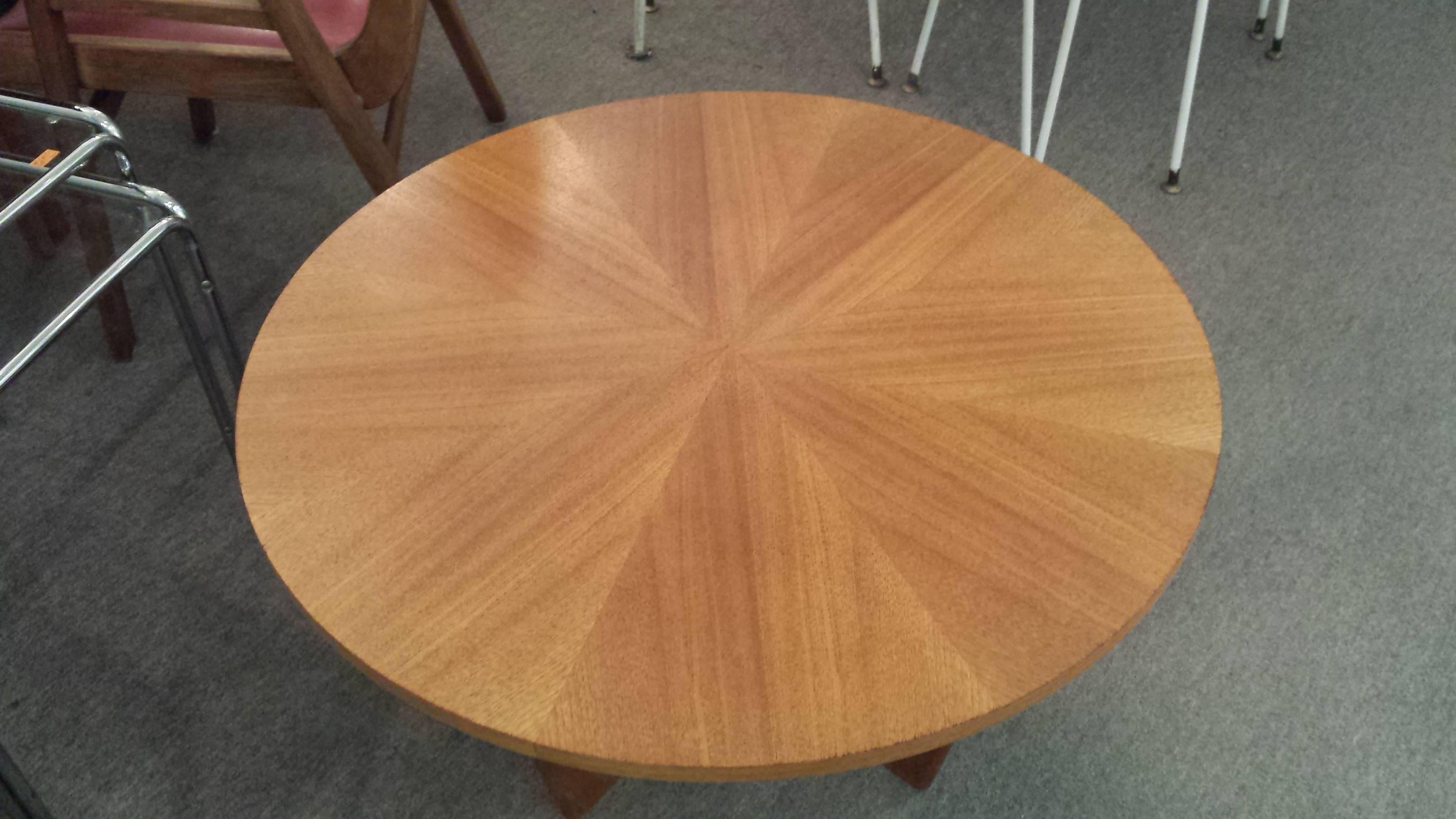 Danish Teak Circular Mid-Century Coffee Table, With Pie Shaped Veneered Top, On a Tapered leg cross base. The table measures 30 1/2