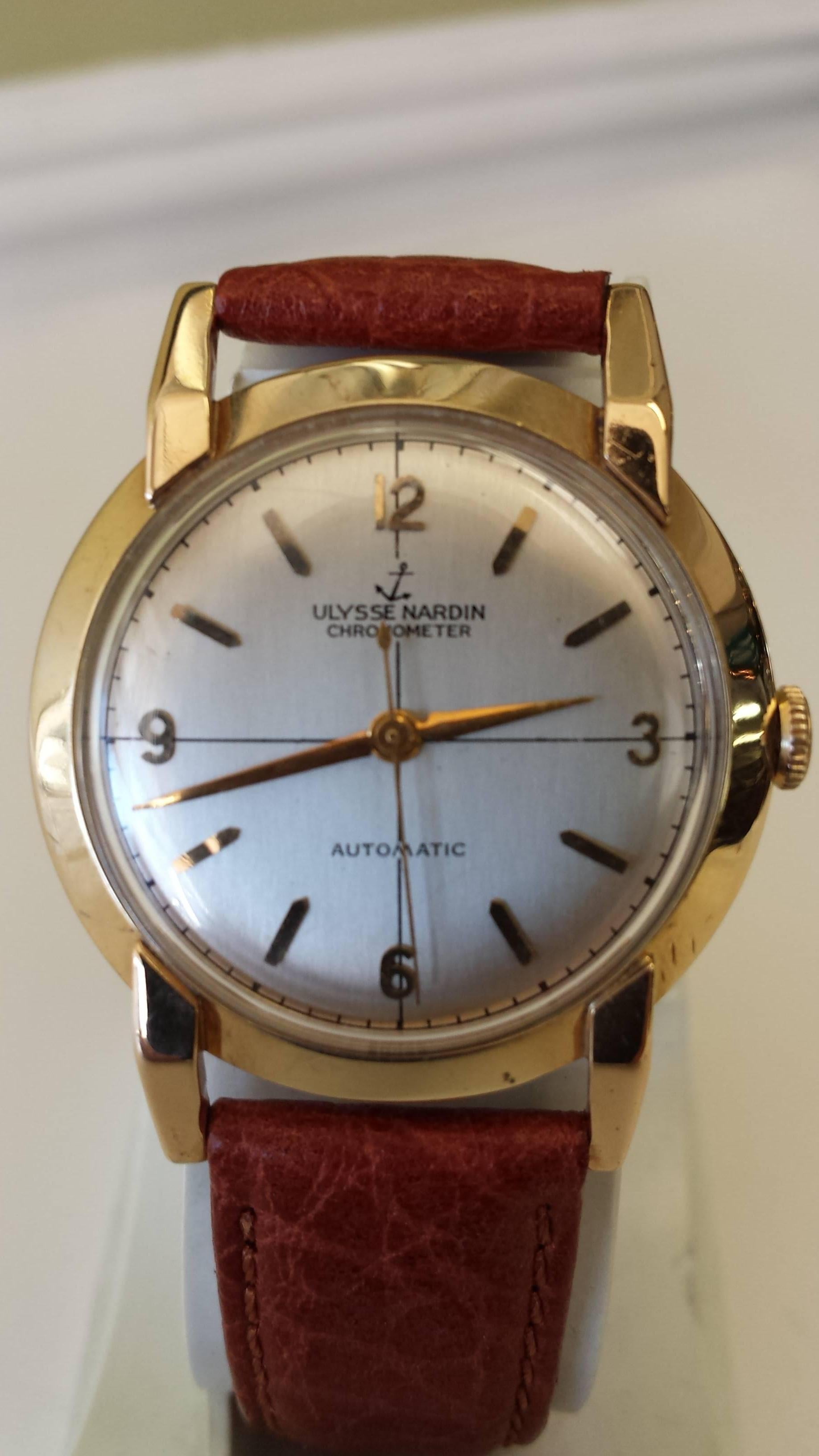 Ulysse Nardin chronometer automatic men's wristwatch in 14K Gold, New replacement leather bracelet, The watch is in good working order and keeps perfect time. Minor marks from wearing the watch, but nothing significant. The watch is 35 mm in