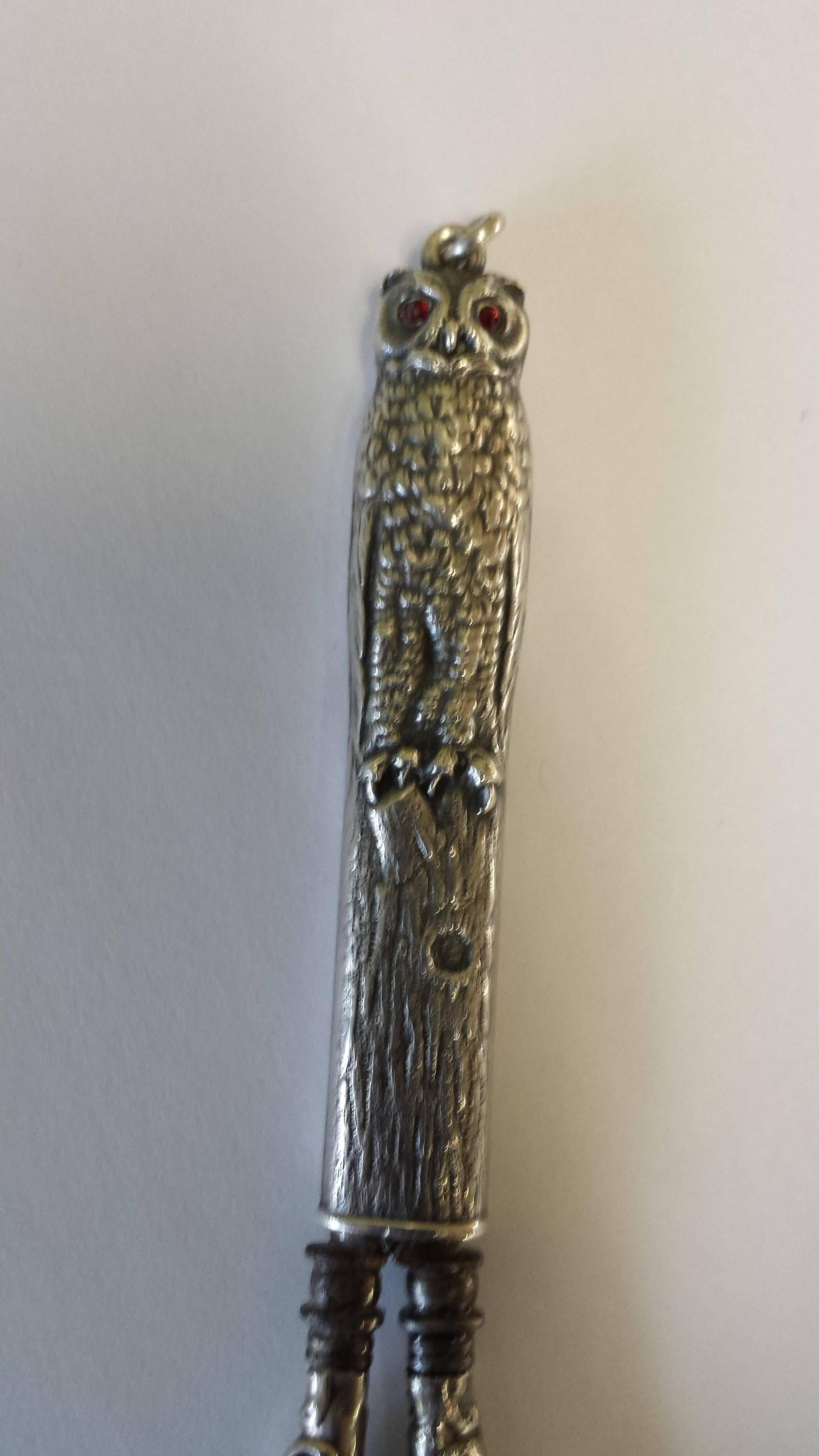 Sterling Silver Victorian Chatelaine Scissors With An Owl In A Tree Cover, Or could be used as a Seamstress Necklace on a chain scissors. The scissor handles are decorated and the cover is a tree with an owl on the top, a small round hanger ring to