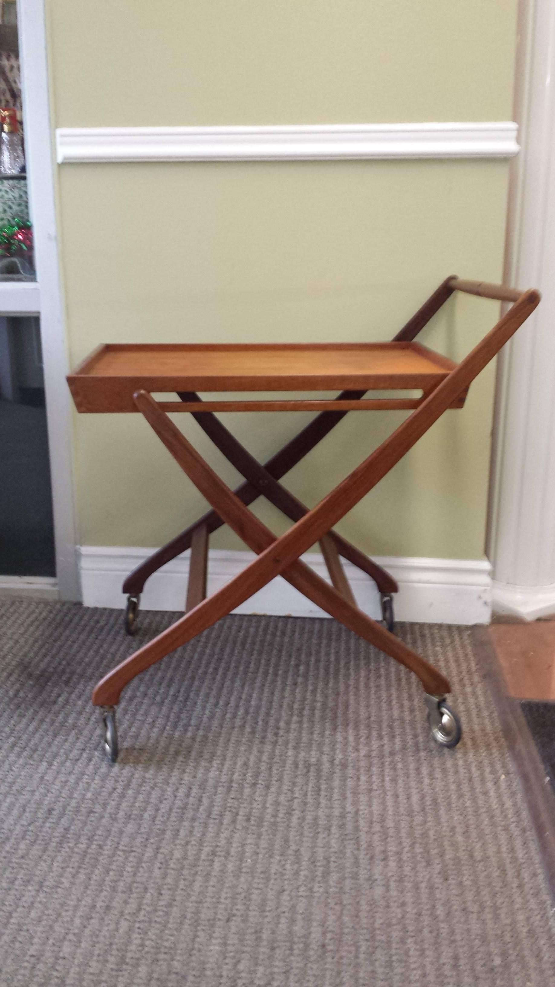 Mid-Century Modern Danish Folding Bar Cart, With Danish Maker/ Control  Mark on bottom stamp. The Cart has 4 -Original Casters, probably 1960's. The cart measures 29"-inches long x 20"-inches wide x 30"-inches to the top of the