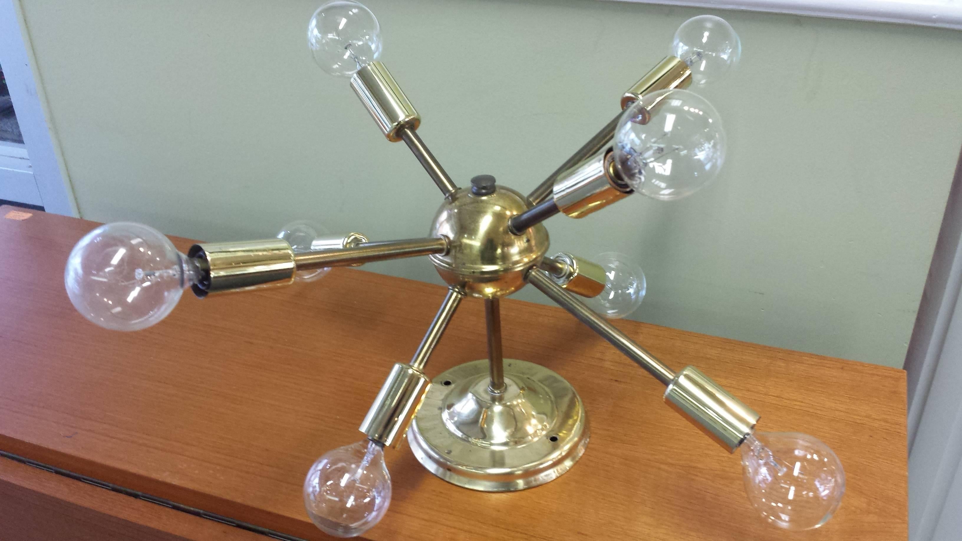 Atomic 8-Arm Brass Sputnick Light Chandelier, circa 1960, The light measures 14