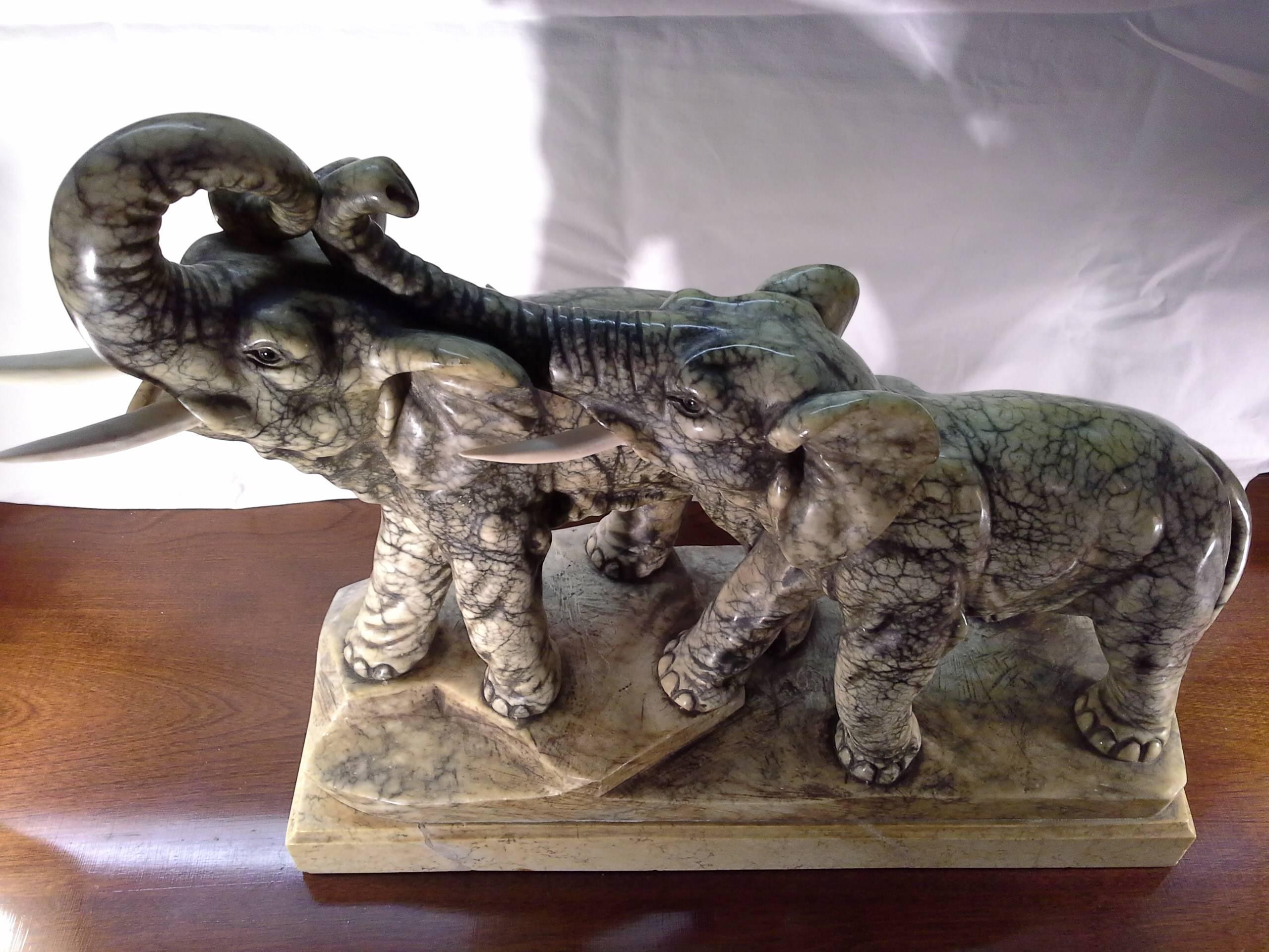 1930's Italian Alabaster Carved &Mounted on a Marble Base, A Sculpture of 2 Bull Elephants with Bone Tusks, Both up raised trunks and bone tusks, Bought in Italy in 1930, Imported to New York.

 There are 7- pages of original purchase receipts,