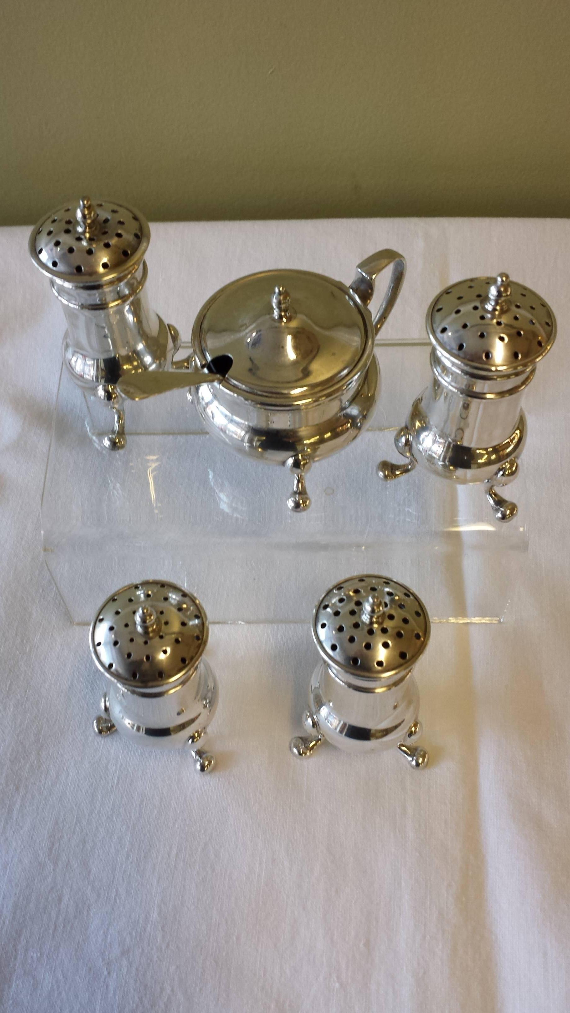 5 Pcs. Sterling Silver Condiment Set & Spoon Retailed By Birks Canada, 4- Salt & Pepper Shakers, Mustard/Condiment  Pot with a blue glass liner and sterling silver spoon. Each piece is on a Queen Anne style leg. The shakers are 2 1/2"-