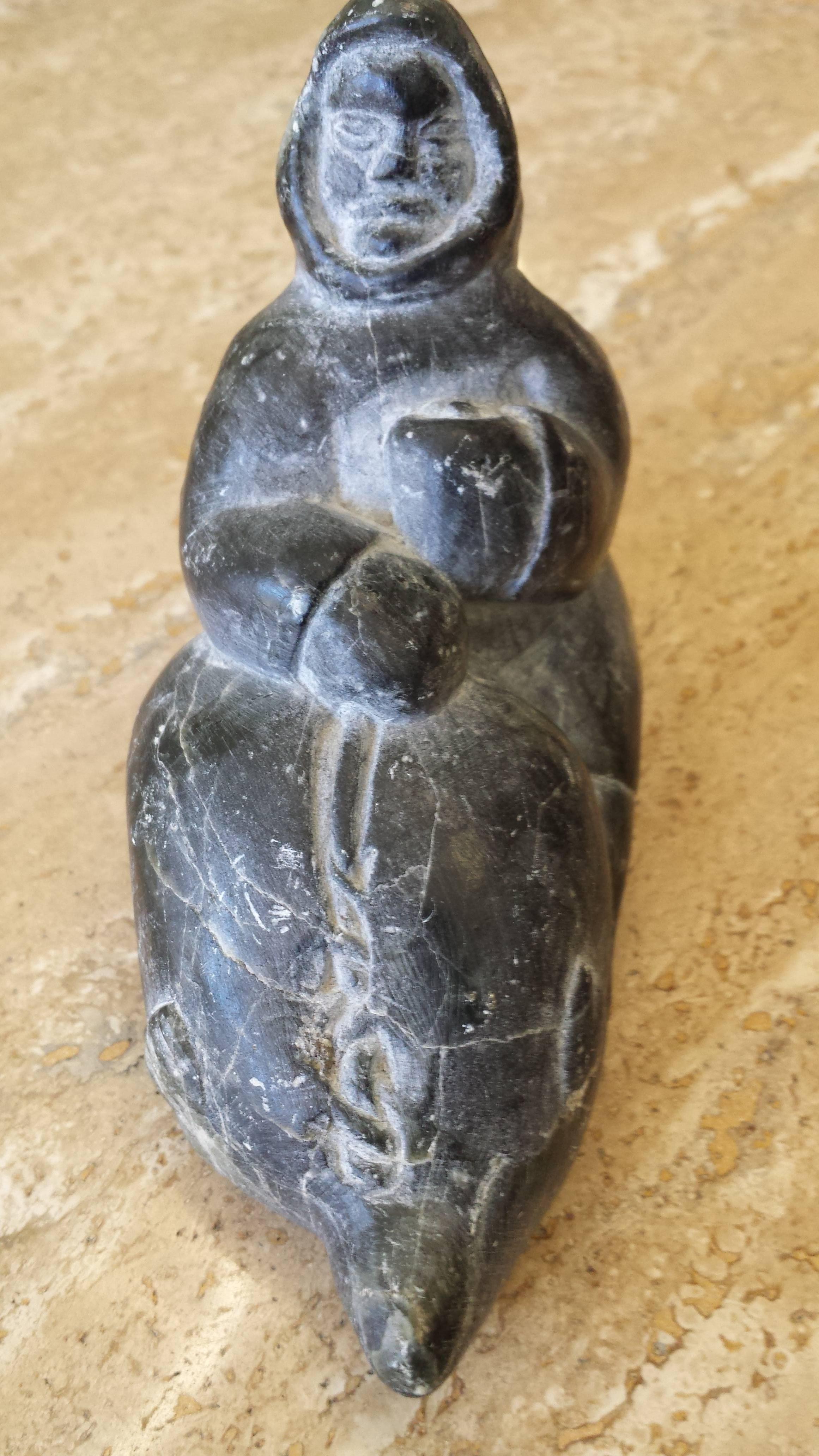 Canadian Soapstone Inuit Hunter Holding Seal Signed in Syllabic, E Numbered for Carver ID
