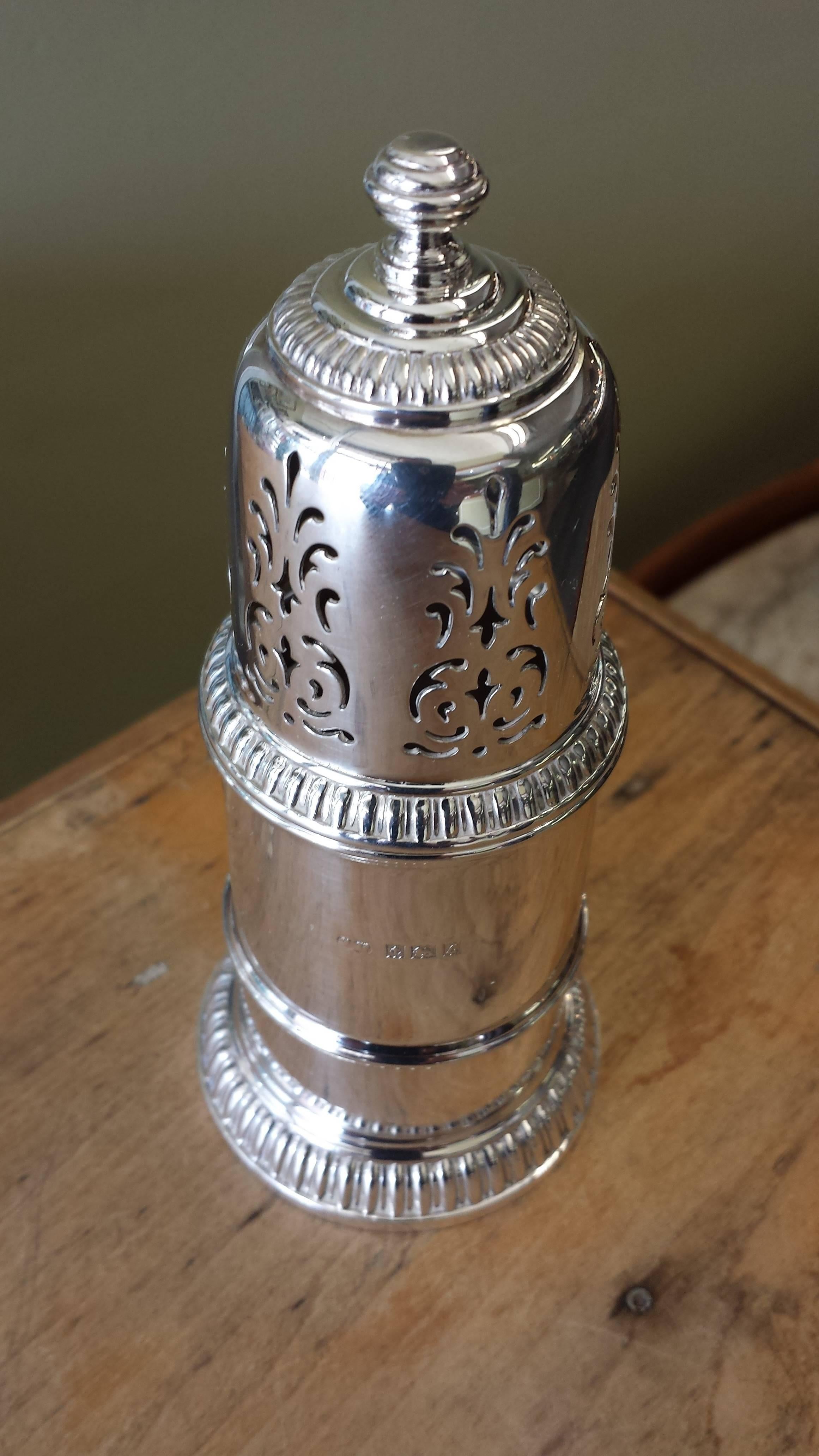 Sugar caster, Birmingham England, hallmarked sterling silver, date letter appears to be fro 1960, in very good condition. No issues, the caster/shaker measures 5 1/4"-inches high x 2 3/8"-inches in diameter.