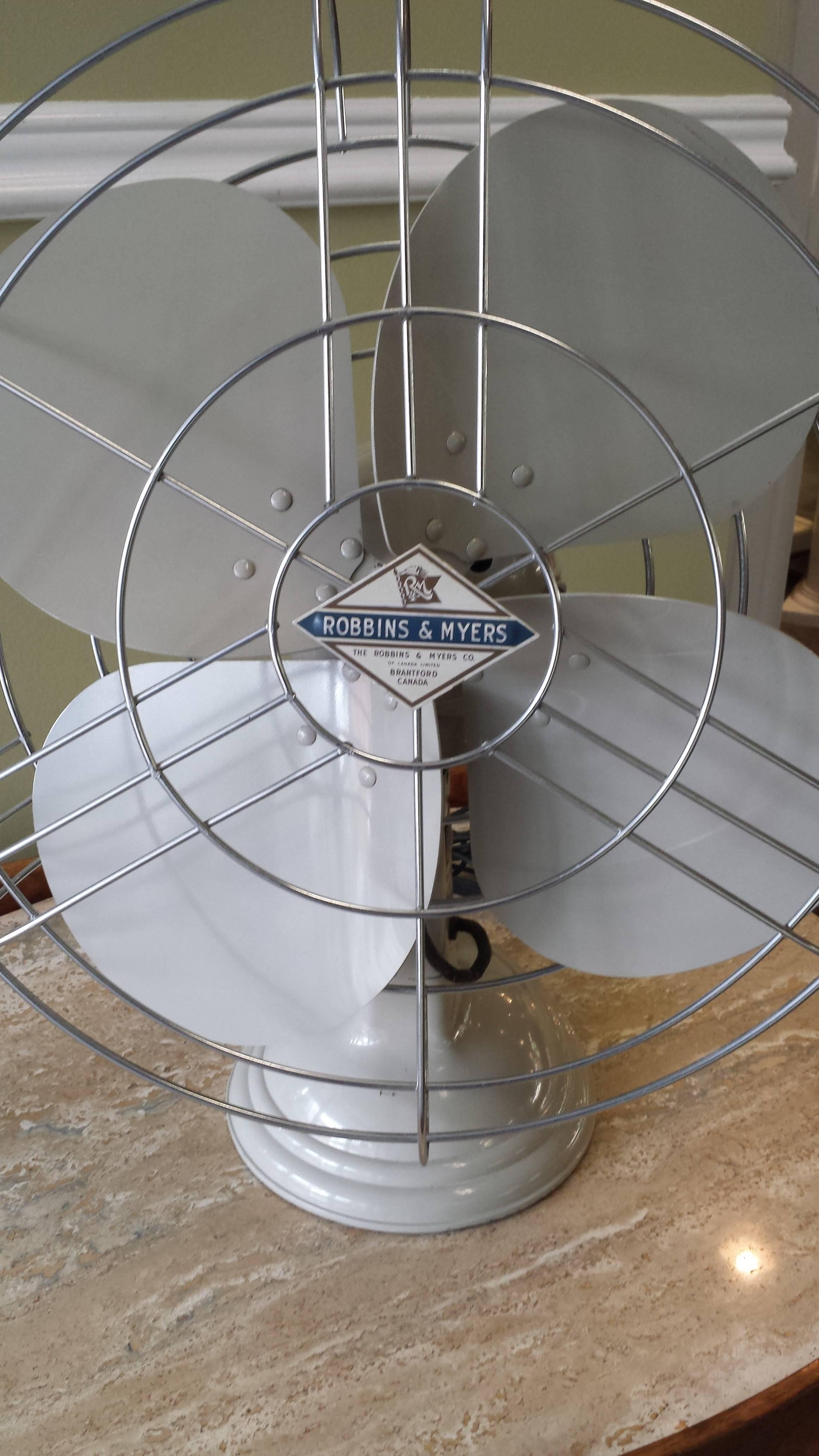 Robbins & Myers Mid-Century electric three-speed industrial table fan 1950s, in a beige color paint, very little wear on the paint, the fan is near mint, chromed safety cage is straight and the chrome is perfect. Made in Brantford, Ontario,