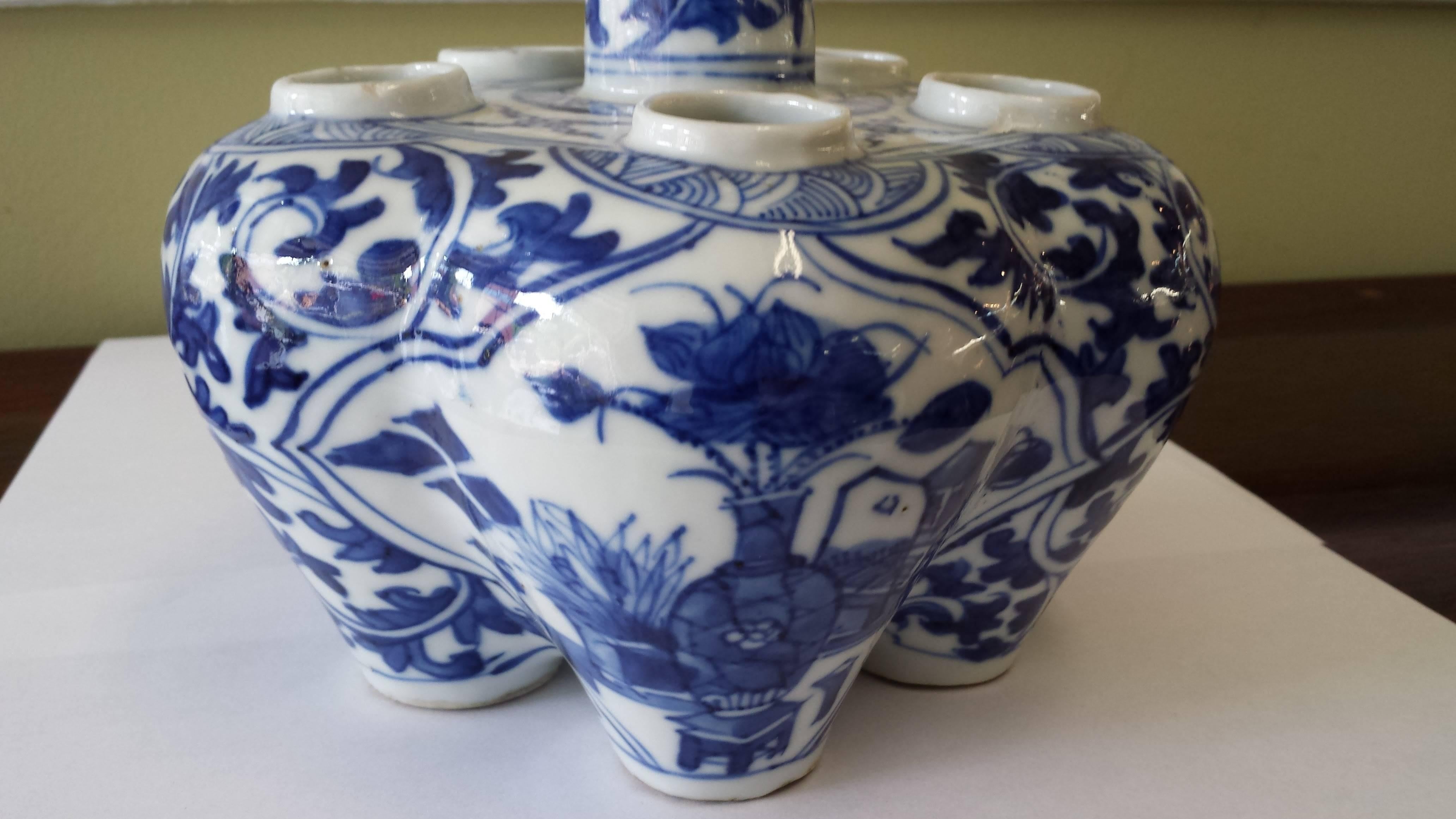 Chinese blue and white tulip/lotus flower vase, 19th century, ogee shaped with five-lower floral inserts and stem/turret shaped top opening for long stem flowers. The vase is nicely decorated with shaped panels containing precious objects with