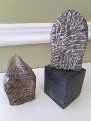An Asian Pair of Buddha Stone Heads, Mixed Pair, Unmounted