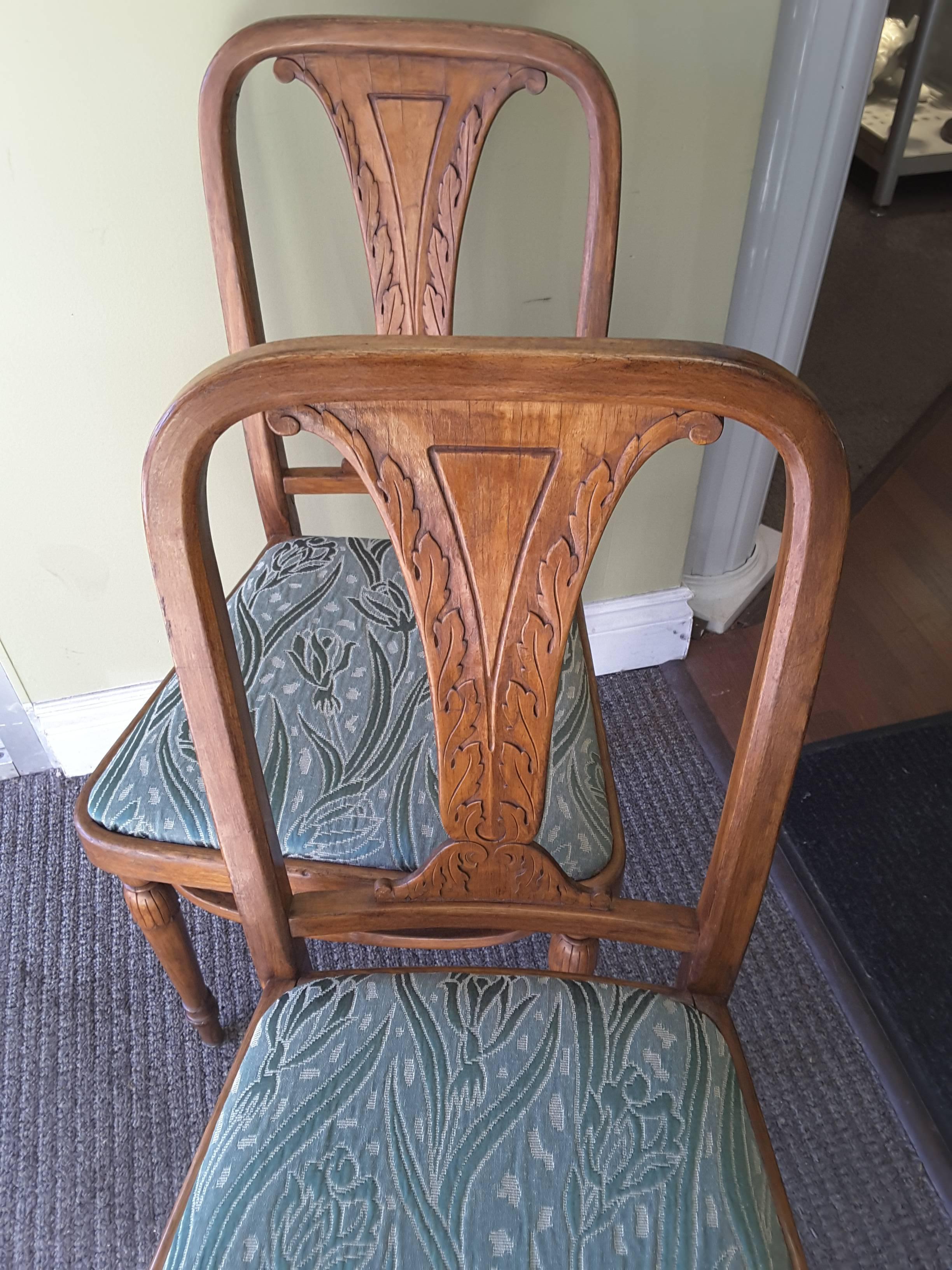 A rare pair of bentwood side chairs by Jacob & Josef Kohn, Czechoslovakia, circa 1920. Made of beech, laminated splat carved with stylized acanthus motif and turned front legs with tassel decoration one piece stretcher. There is a remnant of a