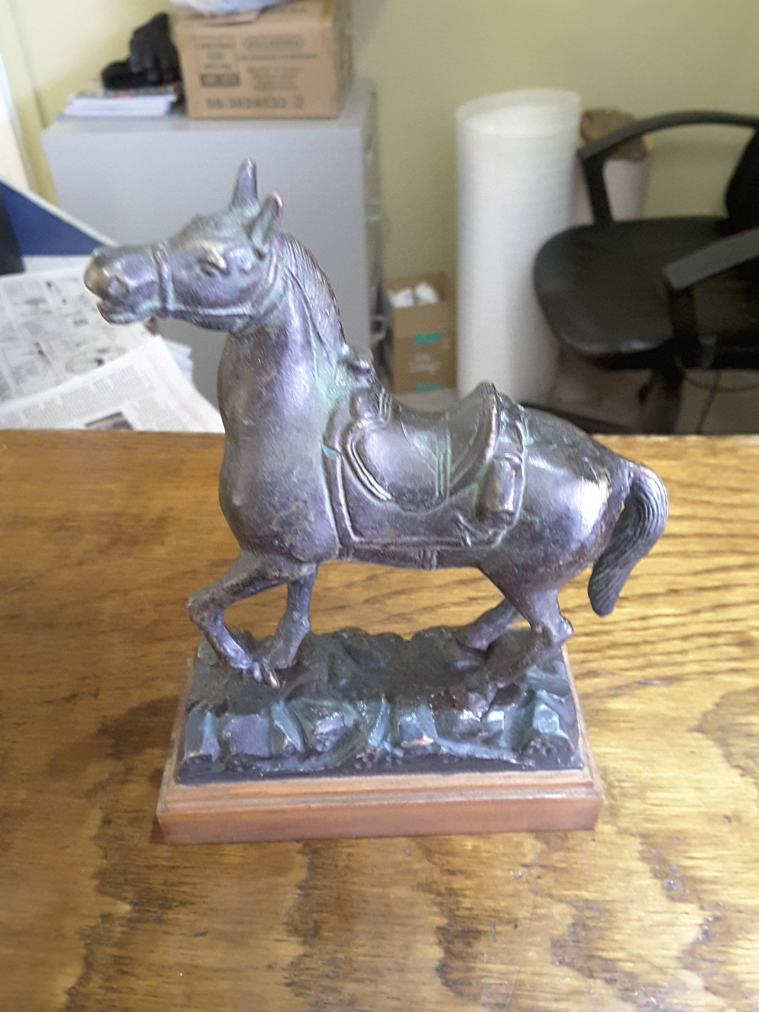 bronze horse statue with saddle