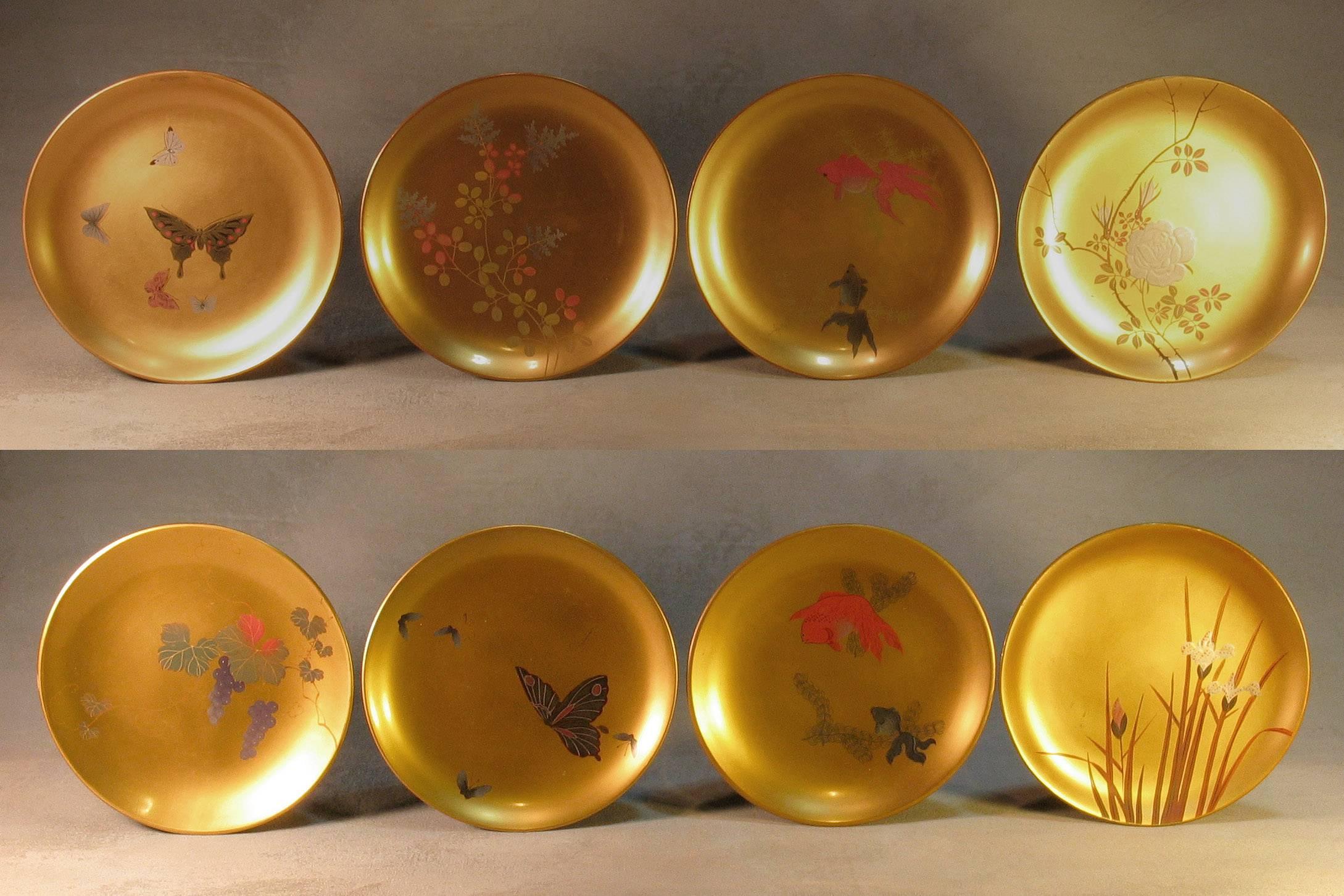 A fine group of eight Japanese lacquer bowls and eight plates, Taisho period, 1912-1926, decorated in a variety of naturalistic designs in takamaki-e lacquer on gold background verso is in a striking Vermillion and black lacquer. The bowls and