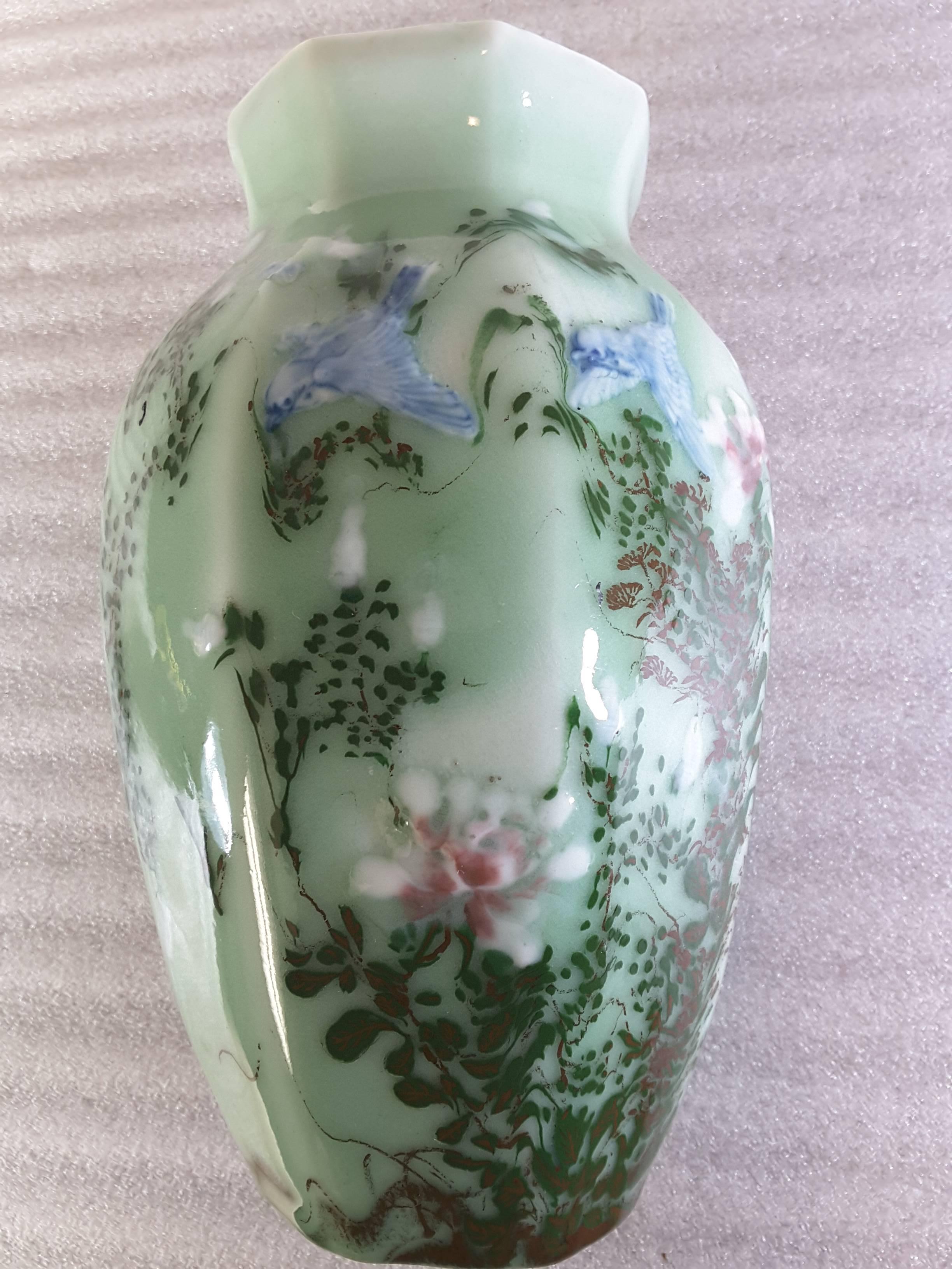 Chinese celadon blue bird and floral decorated hexagon vase, circa 1900. Nicely decorated with Blue birds and multicolored foliage on a light celadon light green colored background. The vase measures 9 3/8