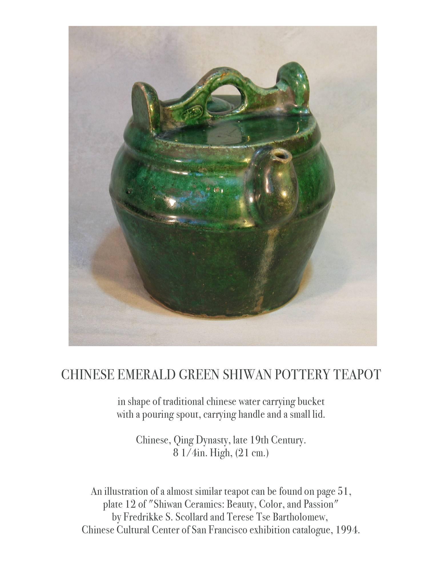 Chinese emerald green shiwan pottery teapot, Chinese, Qing Dynasty, late 19th century. In the shape of a traditional Chinese water carrying bucket with a pouring spout, carrying handle and a small lid. The teapot measures 8 1/4