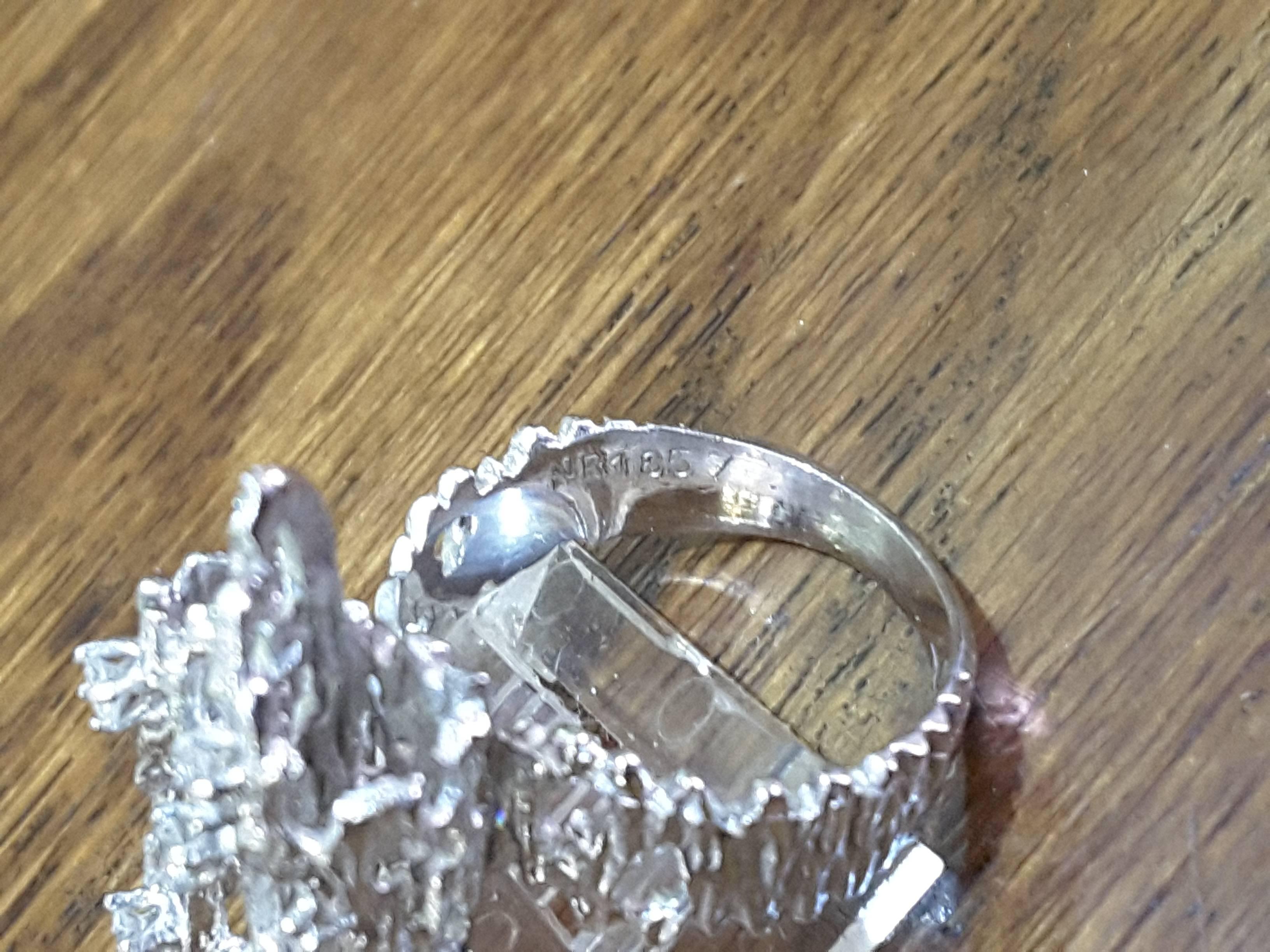 Modernist 18k white gold and diamond ring, with 5 diamonds, each diamond is claw set, Open sides on band and double circle top in a modernist/Brutalist style. The appraisal photo included, (recently updated), total weight is about 0.25. The diamonds