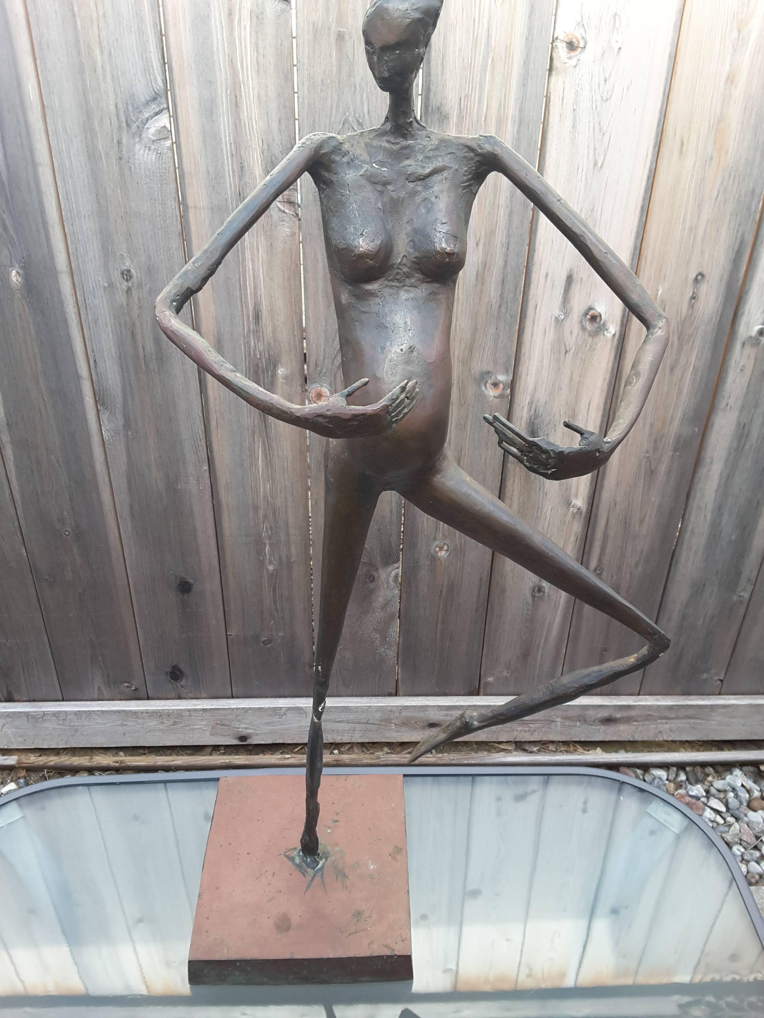 Limited Edition #4 of 8, modern sculpture by Bruce Garner, signed and dated, 75 for 1975. The sculpture is of a large-scale 32 1/2" inches tall x 14" inches wide x 12" inches deep.
The solid bronze sculpture is of a woman in a an