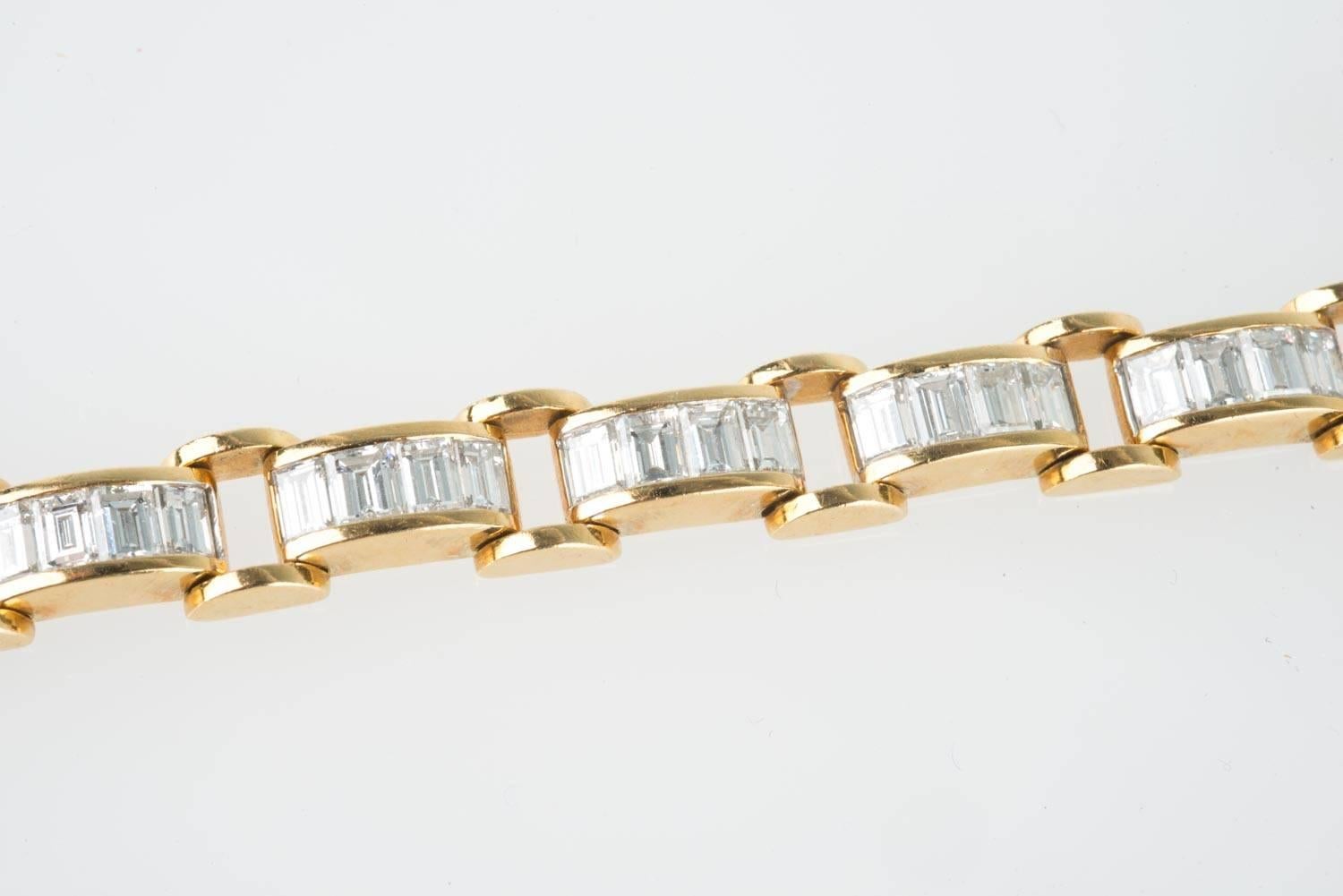 18K Stamped .750 yellow gold and diamond bracelet 6.85-carat tcw, GIA certified, in a Chain Link style, with a total of 60 Baguette diamonds. The bracelet is approximate 6 1/2"-inches long x 1/4"-inches x 1/8"-inches thick. The