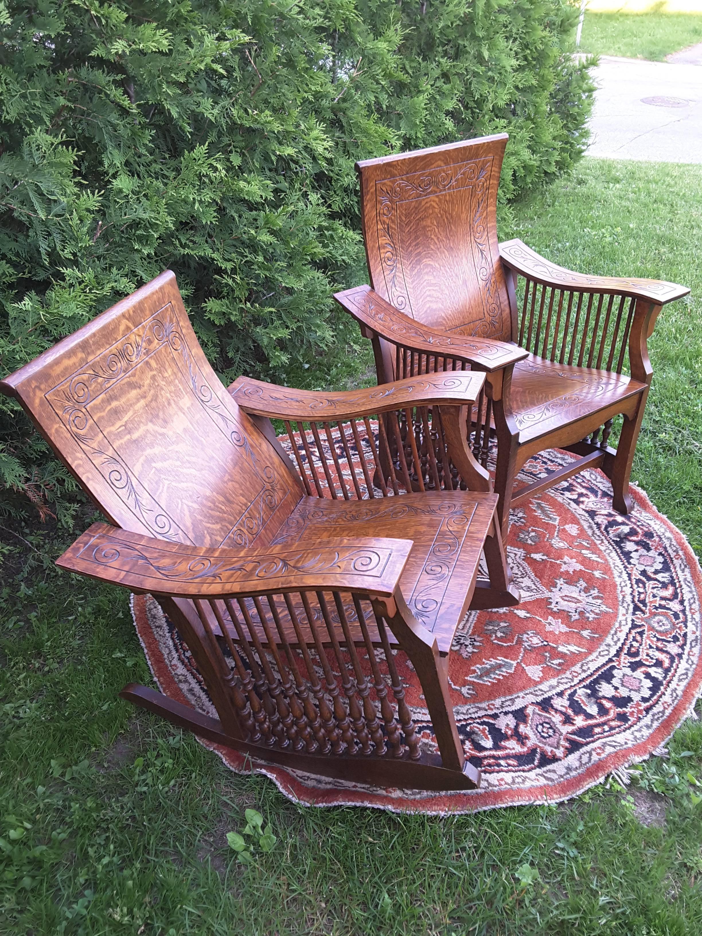 A matched pair of quarter cut sawn oak bentwood carved chairs, One is an armchair the other is a rocker, both are quarter cut oakwood with turned spindles and bentwood seats, backs and arms, carved pattern on all pieces, Both have turned spindles
