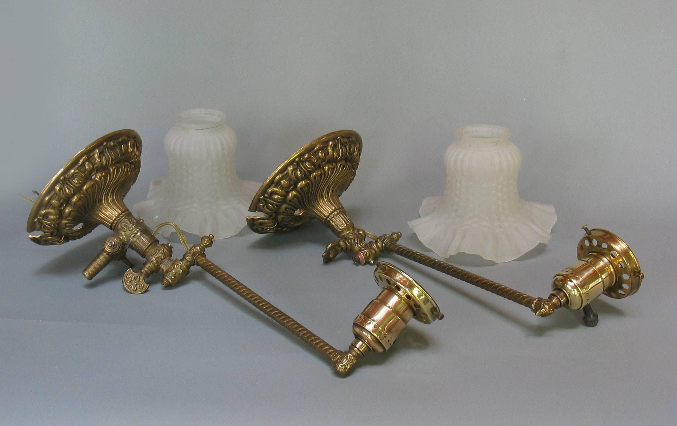 American Near-Pair of Victorian Brass Swing Arm Gas Light Sconces