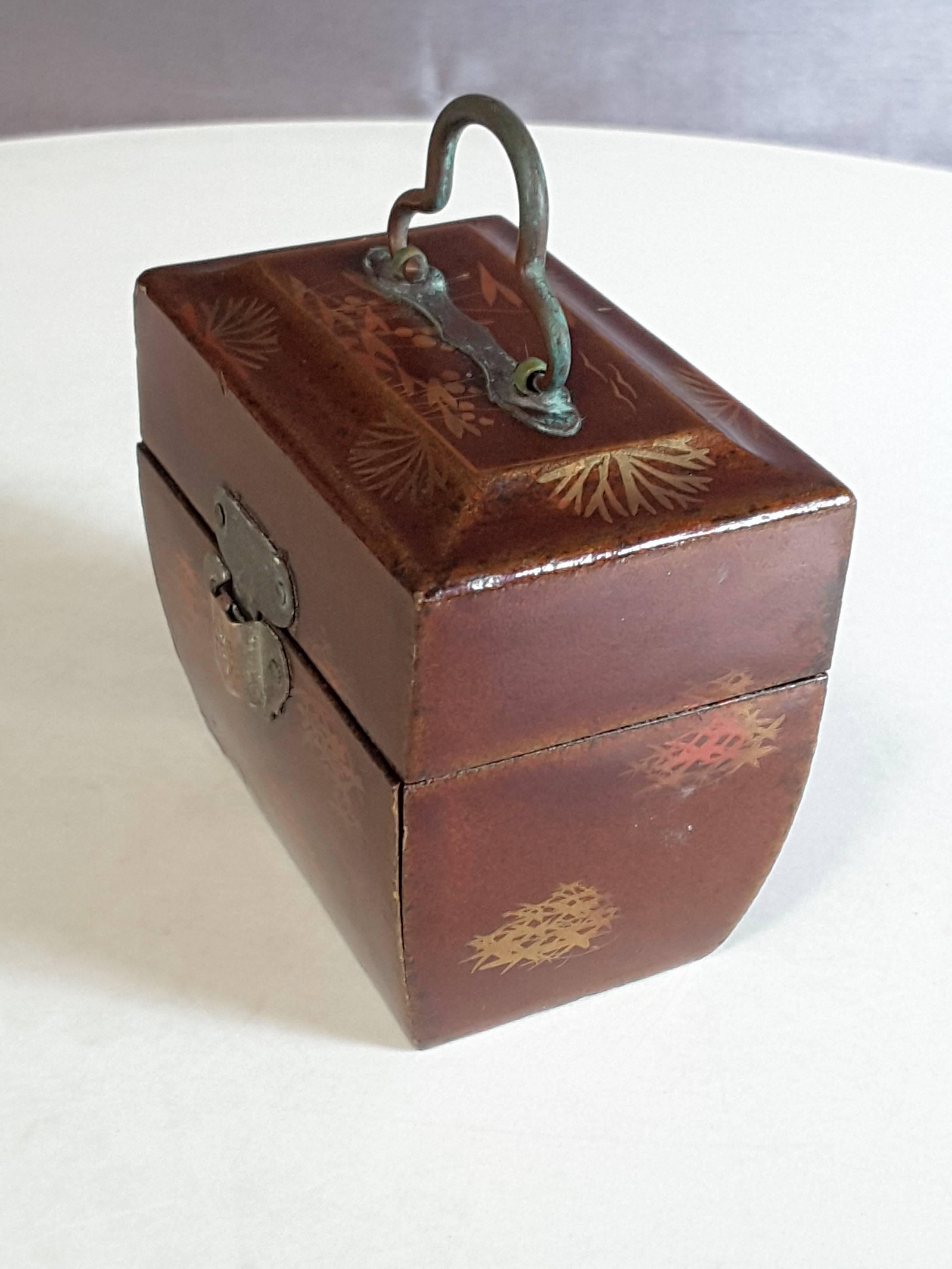 Miniature Chinese herb/medicinal fitted case with two glass bottles, the case is made of wood, light brown finish with gilt decoration and metal handle and clasps. The interior is blue felt lined and divided in two sections for glass bottles and