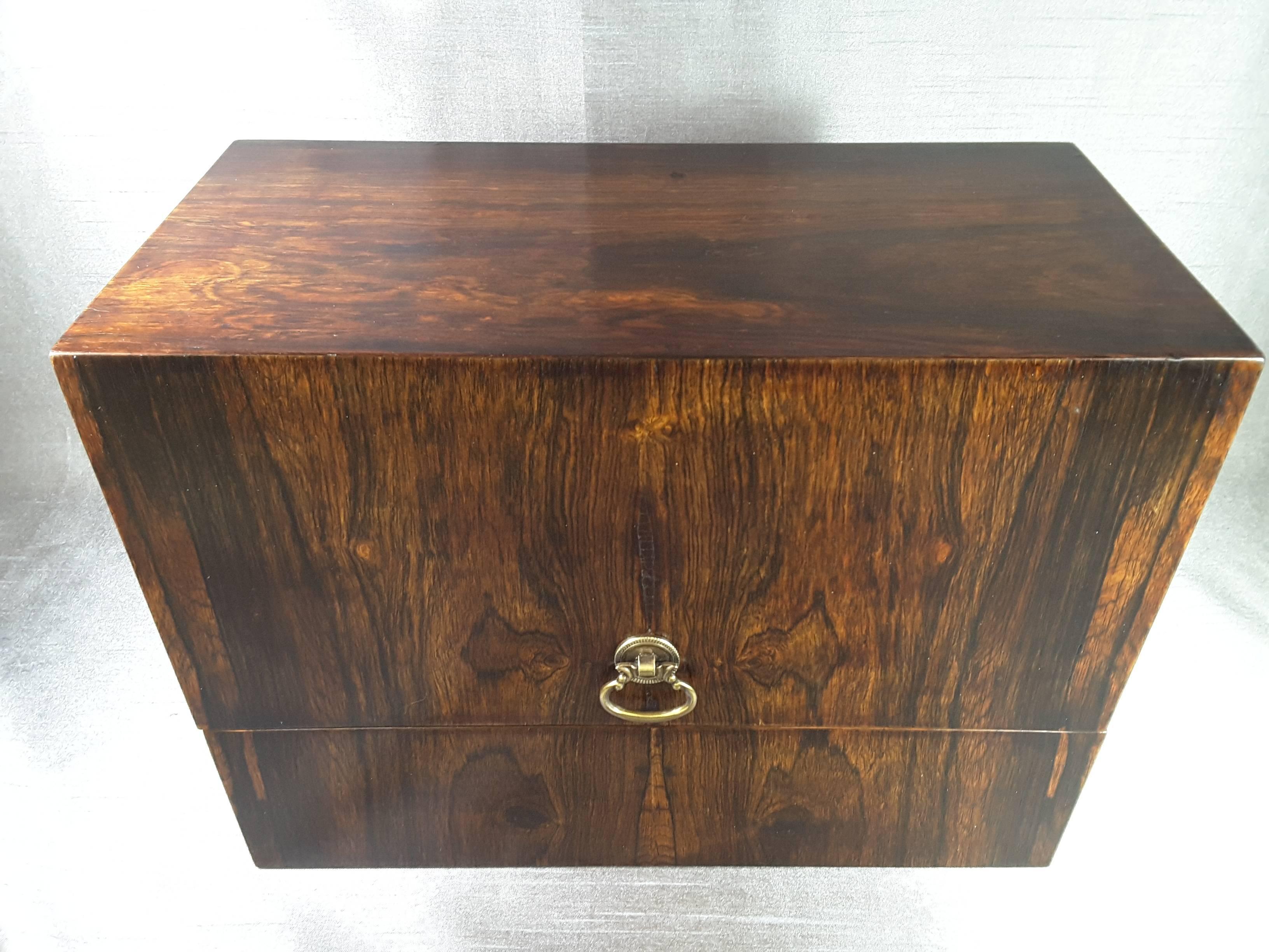 Rosewood upright canteen or cutlery box with a flip top, center pull front brass handle, the cutlery stands upright in the canteen and has section for serving pieces on the back left side. The cutlery canteen measures 11 11/4