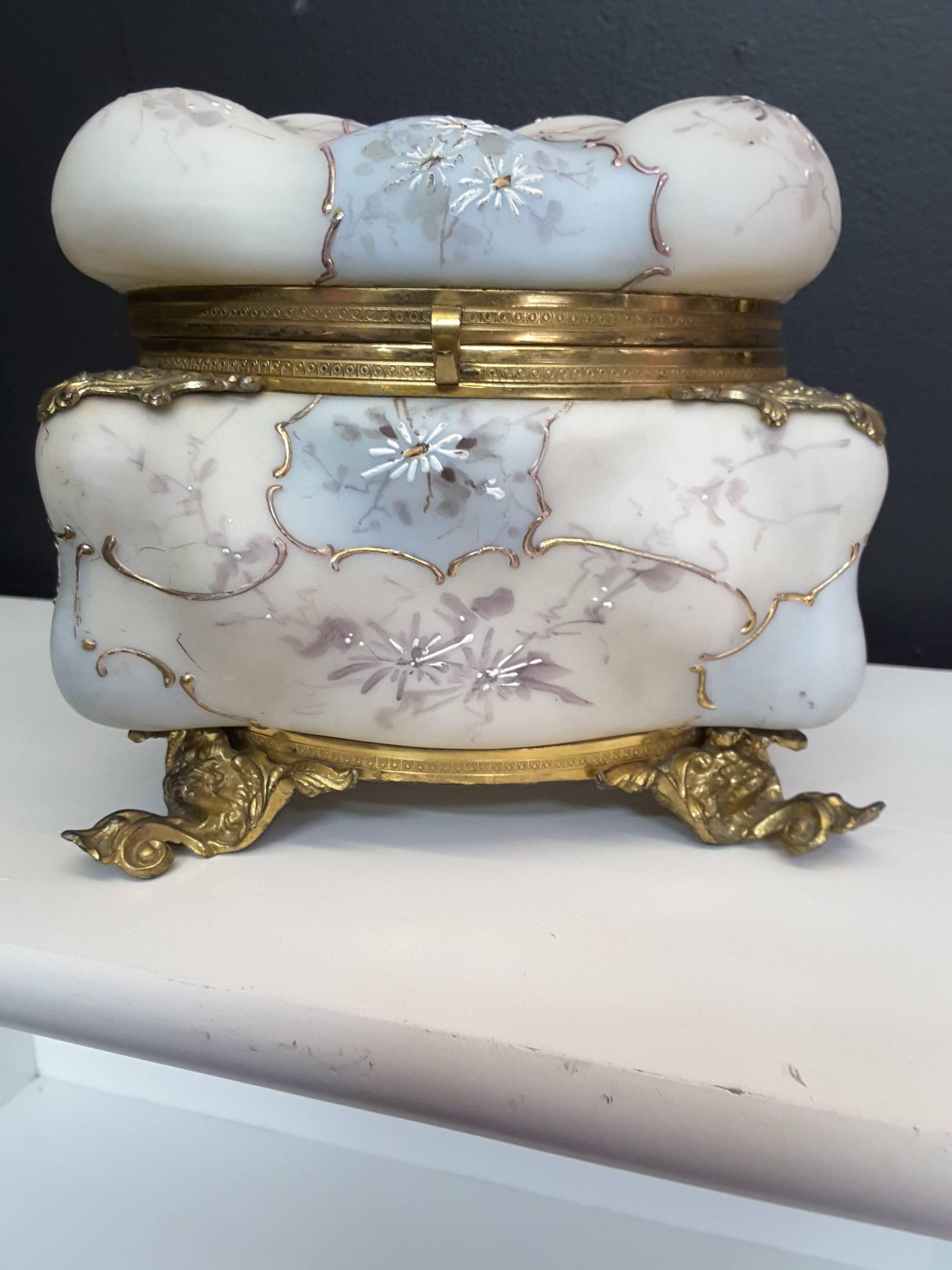 Largest size made wave crest floral jewelry casket/trinket box, in a white bulbous opalescent glass with raised enamel painted floral decoration, painted in bordered cartouches. White painted flowers, grey and silver vines, the cartouches are done