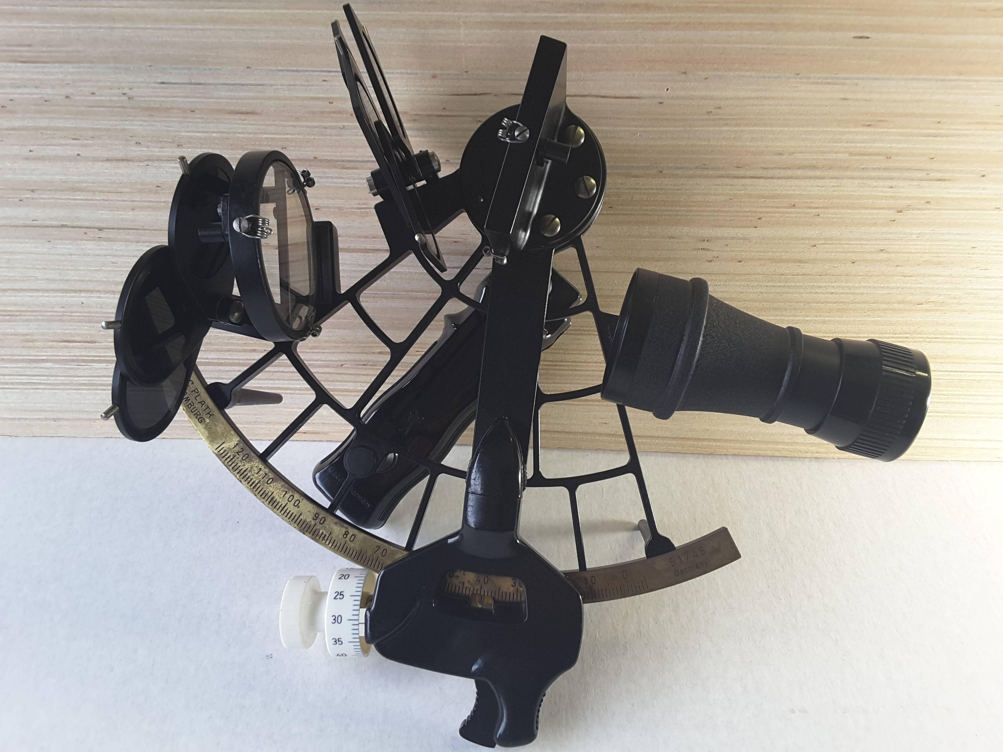 A fully functional German ship sextant from 1968 in fine working condition, the sextant is in the original solid mahogany case, with the instruction manual, accessories, and a battery operated Celestrial calculator for latitude/longitude, which was