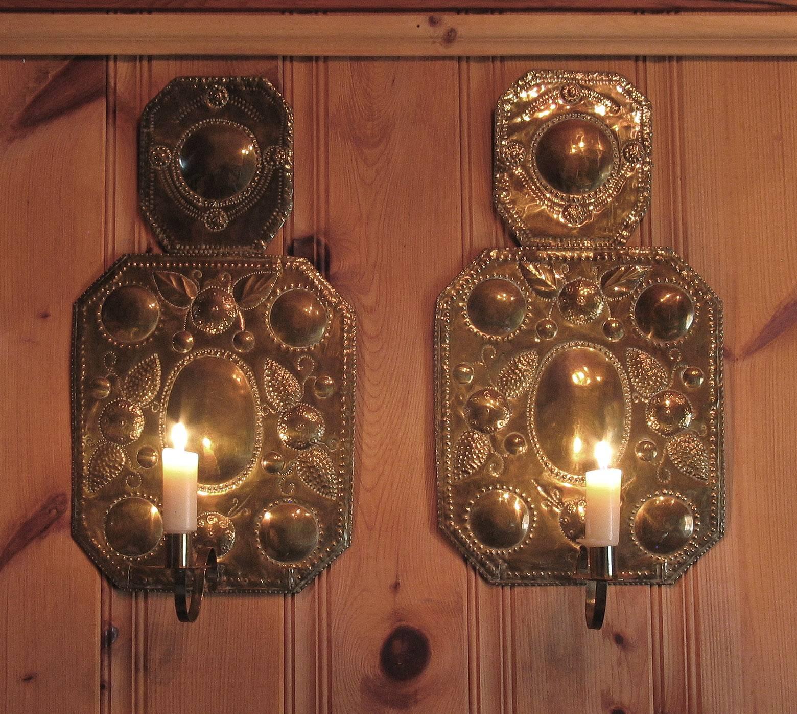 Arts and Crafts Pair of Swedish Arts & Crafts Brass Repoussé One Light Wall Candle Sconces