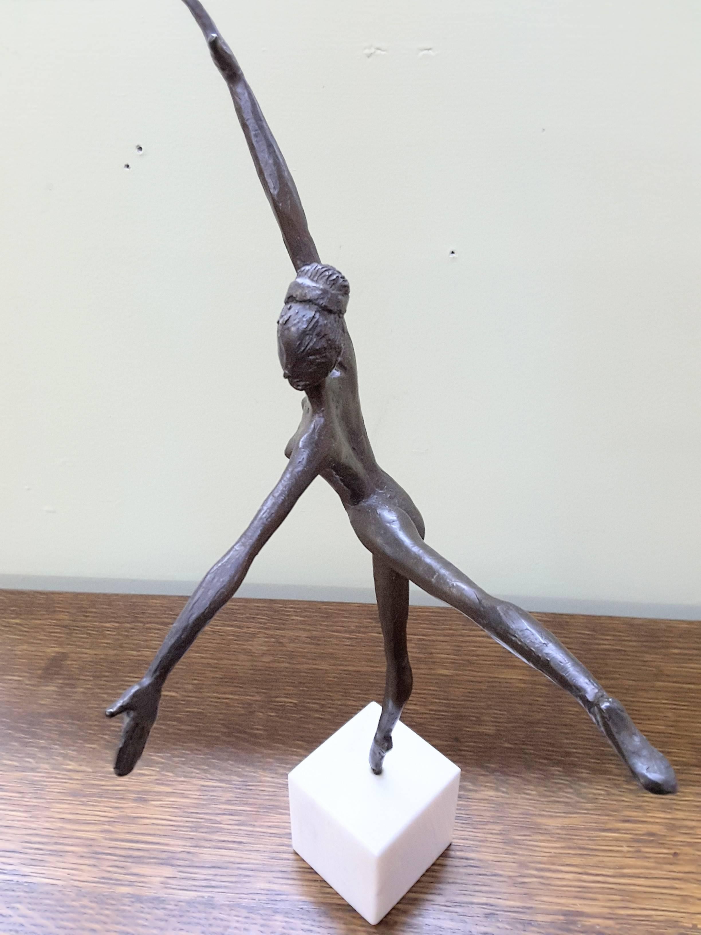 A bronze Ballerina on marble base Almuth Lutkenhaus (1930-1996), Modern style figure standing on one leg with the other behind her and her arms out stretched. The dancer is mounted on a white square marble base, and is signed on the out stretched