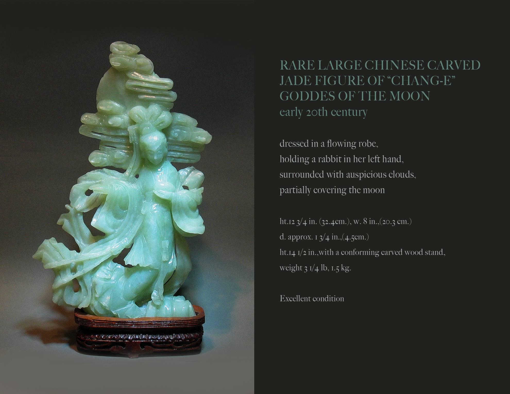 Rare large Chinese carved jade figure of "Change-E" Goddess of the Moon, early 20th century. 
Dressed in a flowing robe, holding a rabbit in her left hand, surrounded with auspicious clouds, partially covering the moon. The Jade figurine
