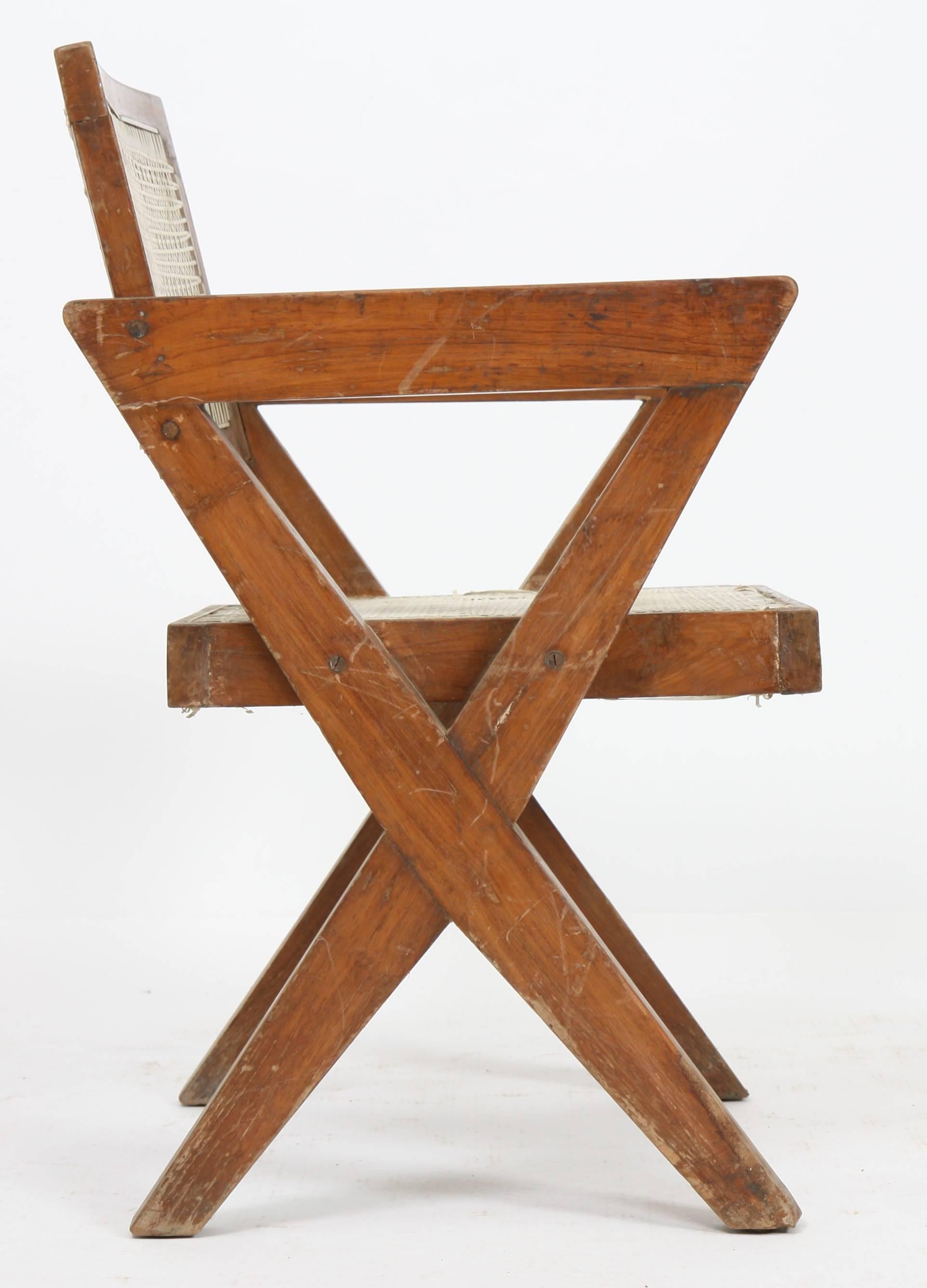 Pierre Jeanneret (1896-1967).
Armchair in teak, with bended and slightly curved back.
Detached armrests profiled on side compass feet.
Cane seat and back,
circa 1963-1964.
Dimension: Height 82cm x Length 55cm x Depth approx. 50 cm.
Origin: