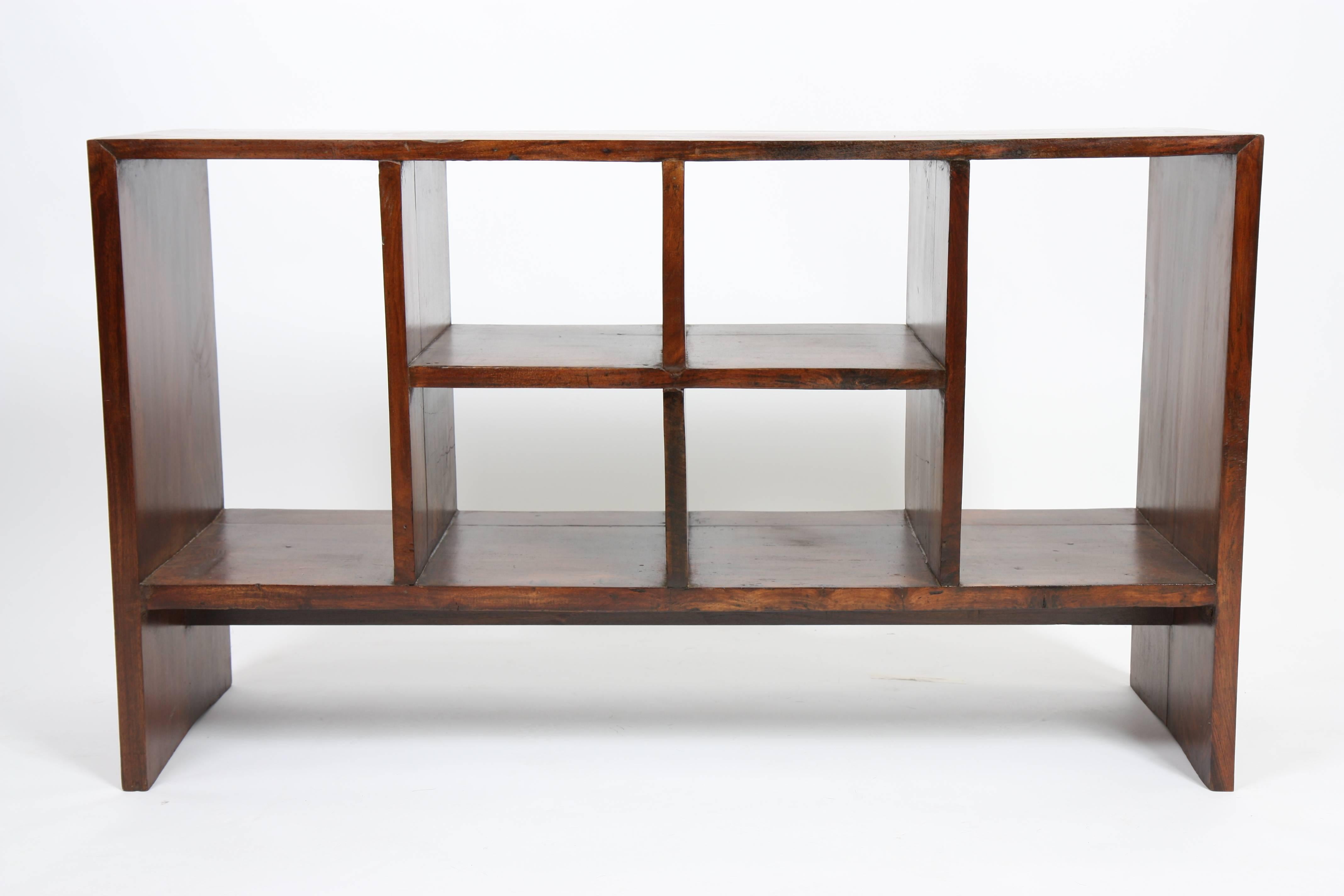 Pierre Jeanneret (1896-1967).
Low double face "File Rack" storage in solid sisso (Indian rosewood).
Six opened bookcase compartments, with four central and two higher lateral.
Base formed by the two side panels of the frame,
circa