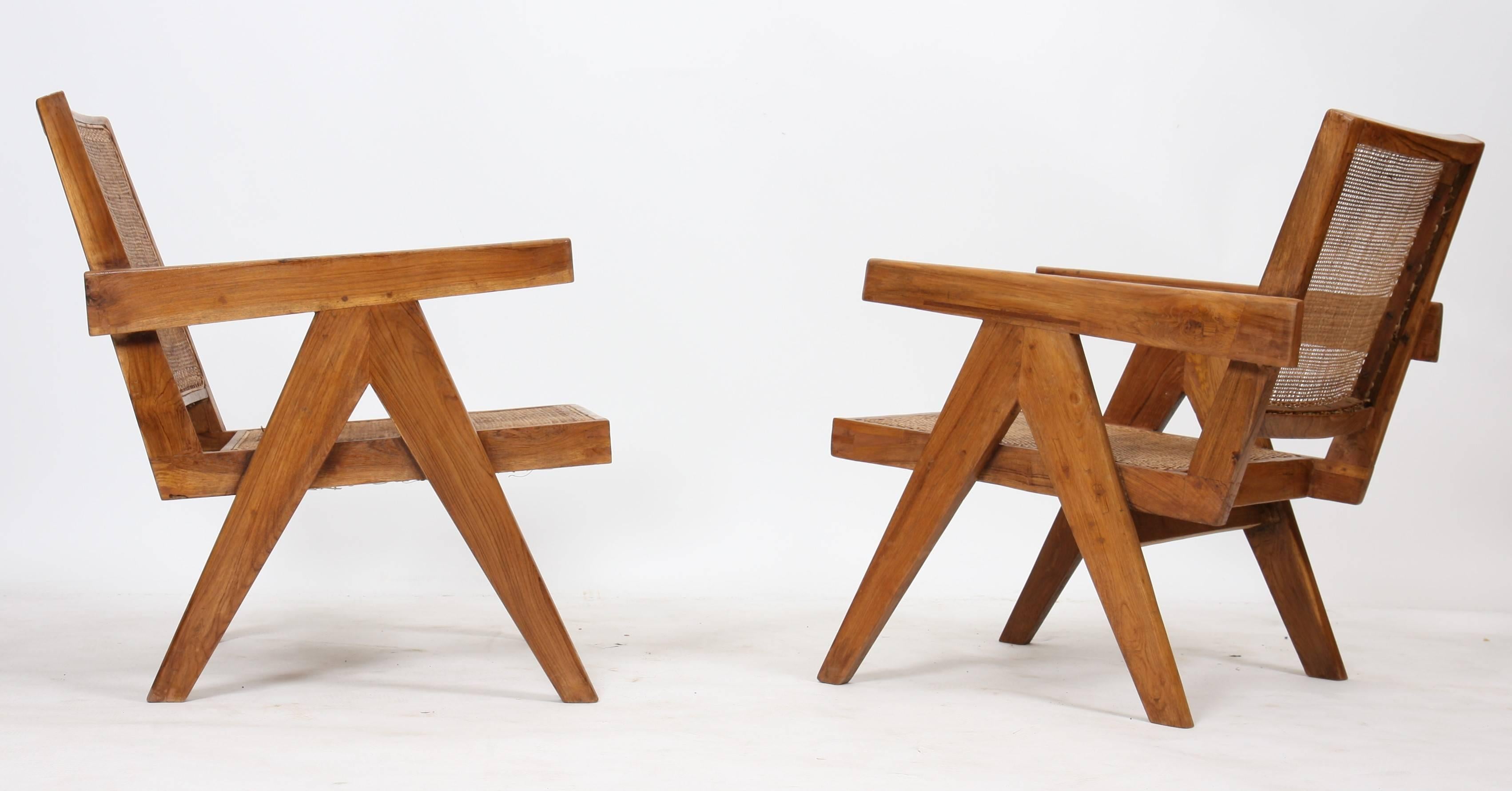 Pierre Jeanneret (1896-1967), set of two easy armchairs.
In teak with profiled and slightly curved backrests and bent seat.
Detected and profiled armrests and side compass design legs.
Cane seat and backrests.
Slight difference from one chair to