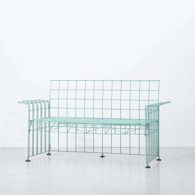 This Abitacolo sofa was designed by Bruno Munari and produced by Robots in Italy in 1972. The frame is made from green lacquered metal and the style vehemently postmodern. It remains in a good vintage condition and it comes with the original pale