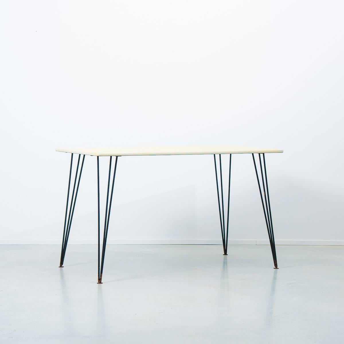 Paul K. Bridston was house designer at Kandya Ltd, working alongside design consultant Frank Guille who was famous for the iconic 'Jason' chair. Bridston is well-known for his model 374 desk, near identical to this table. Both are made from painted