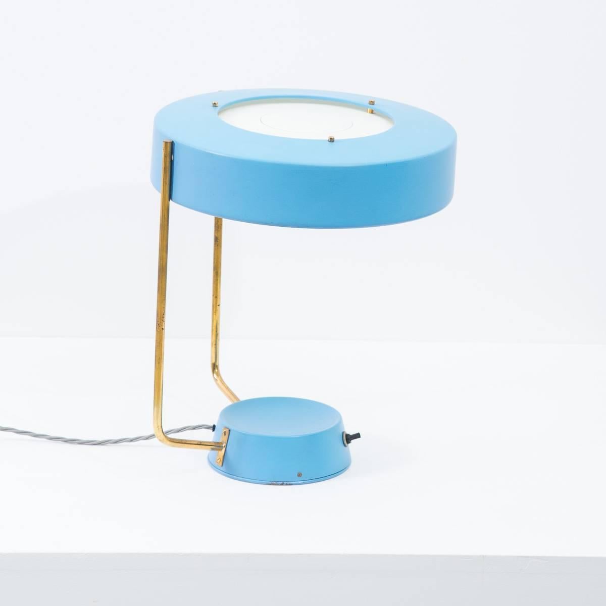 An extremely rare desk lamp in near perfect condition. An original Stilnovo piece bearing the early yellow Stilnovo mark. This matt blue, double brass stemmed desk lamp with glass diffuser and three small screw bulbs fittings, was designed and